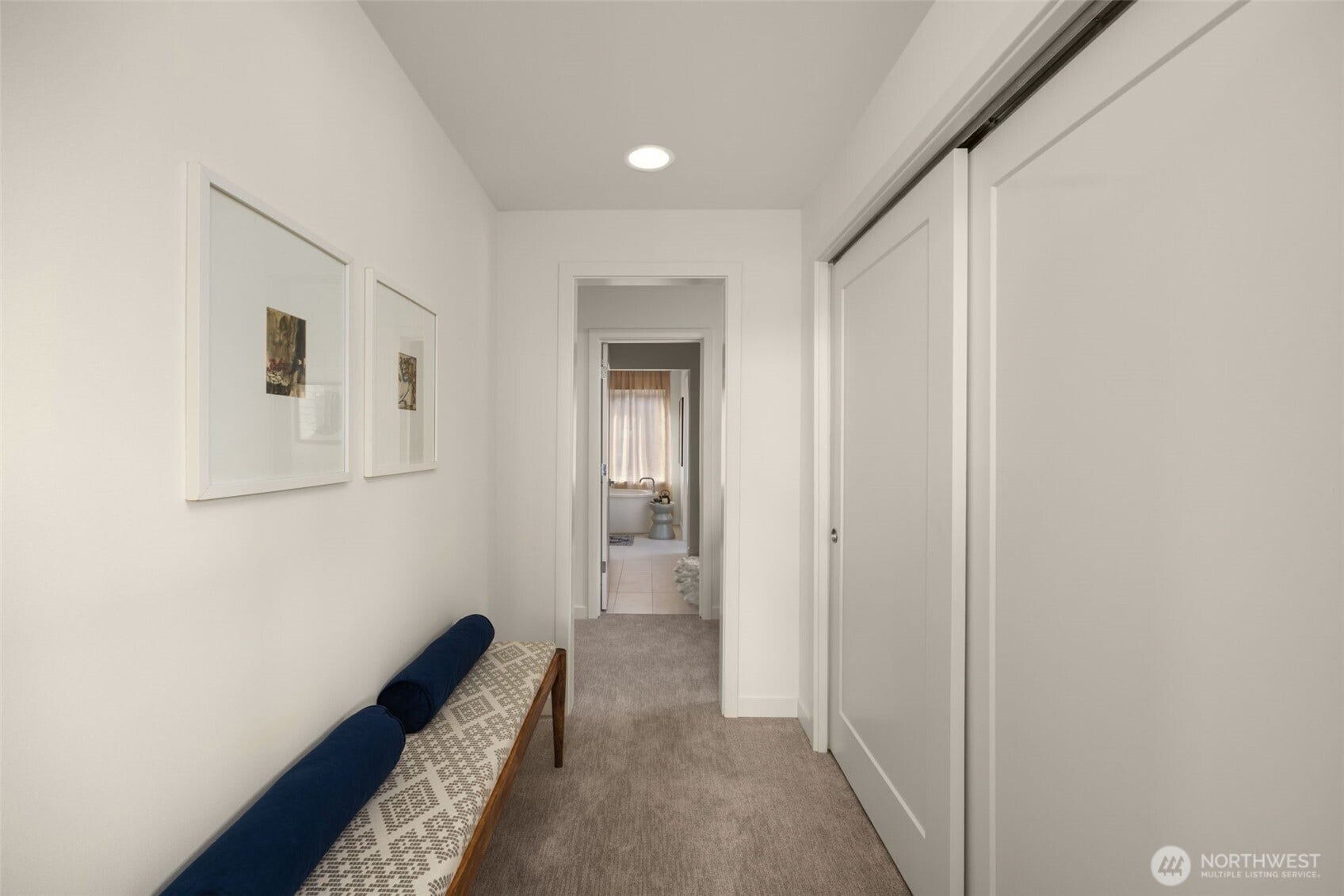 Hallway with sliding door storage