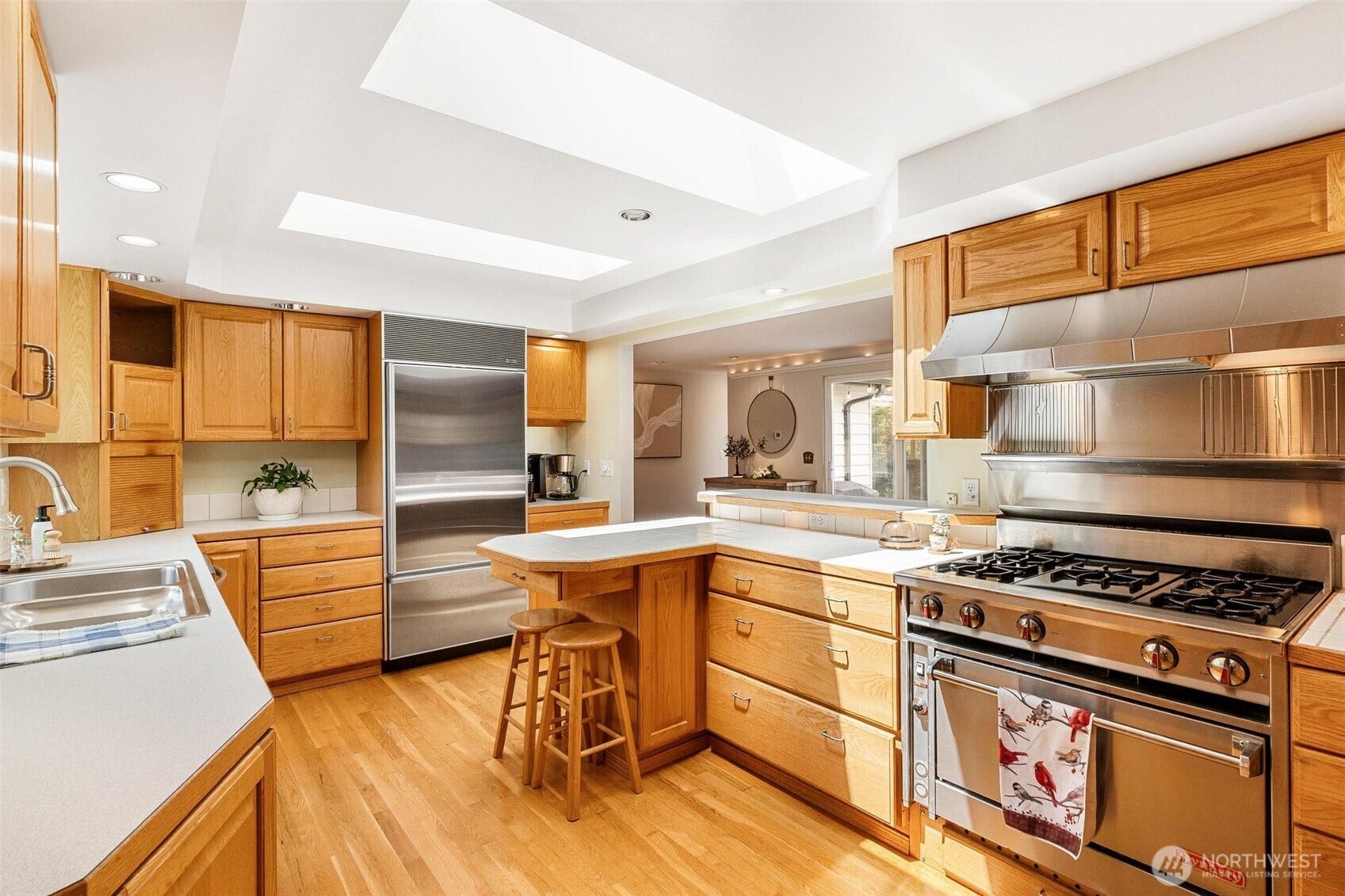 Let's cook! Commercial range, two appliance caddies, two ovens, two sinks with disposals, and plenty of storage.