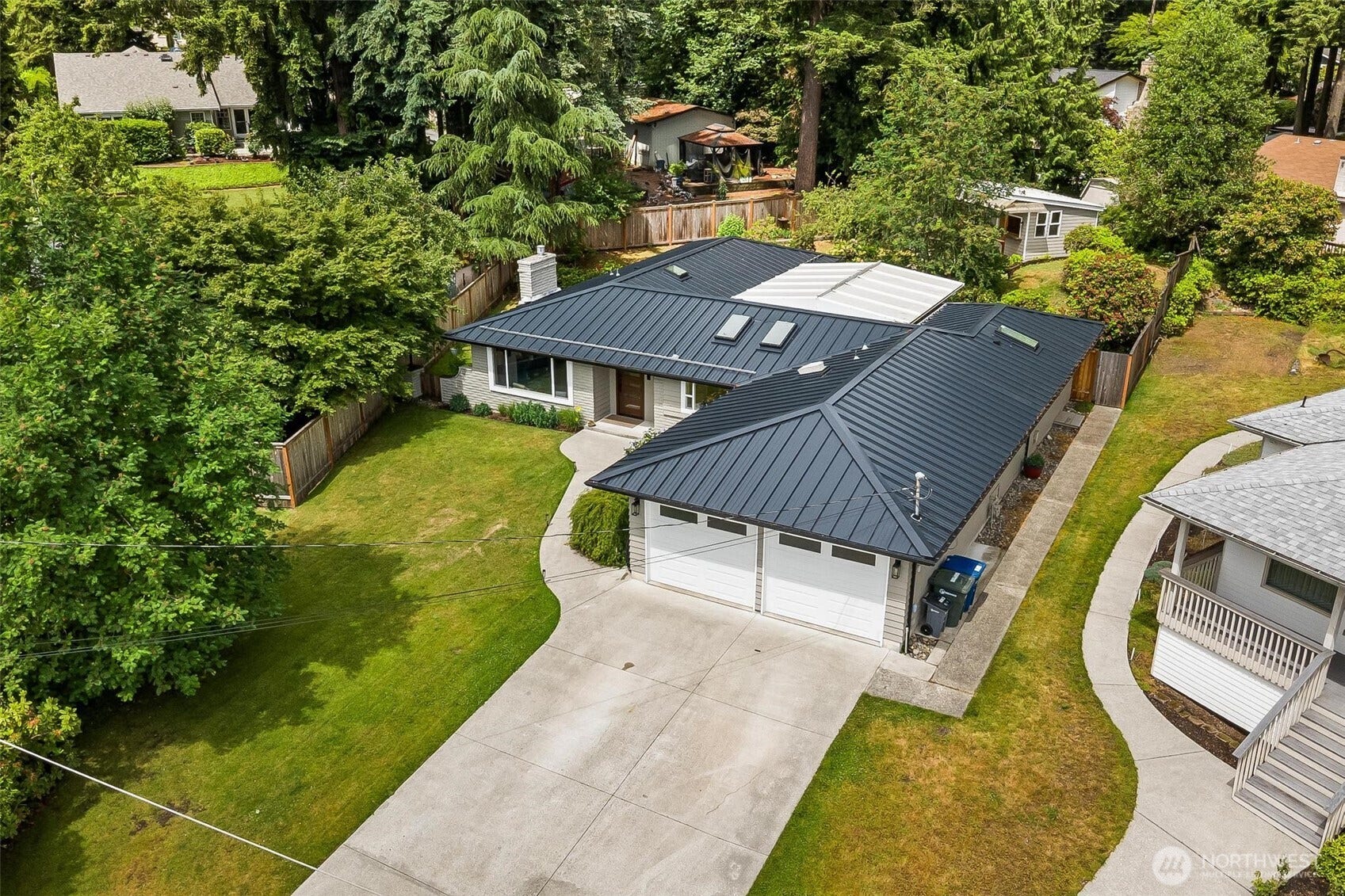 New metal roof.  The white roofing is the covered patio - which is a room you'll spend lots of time in.