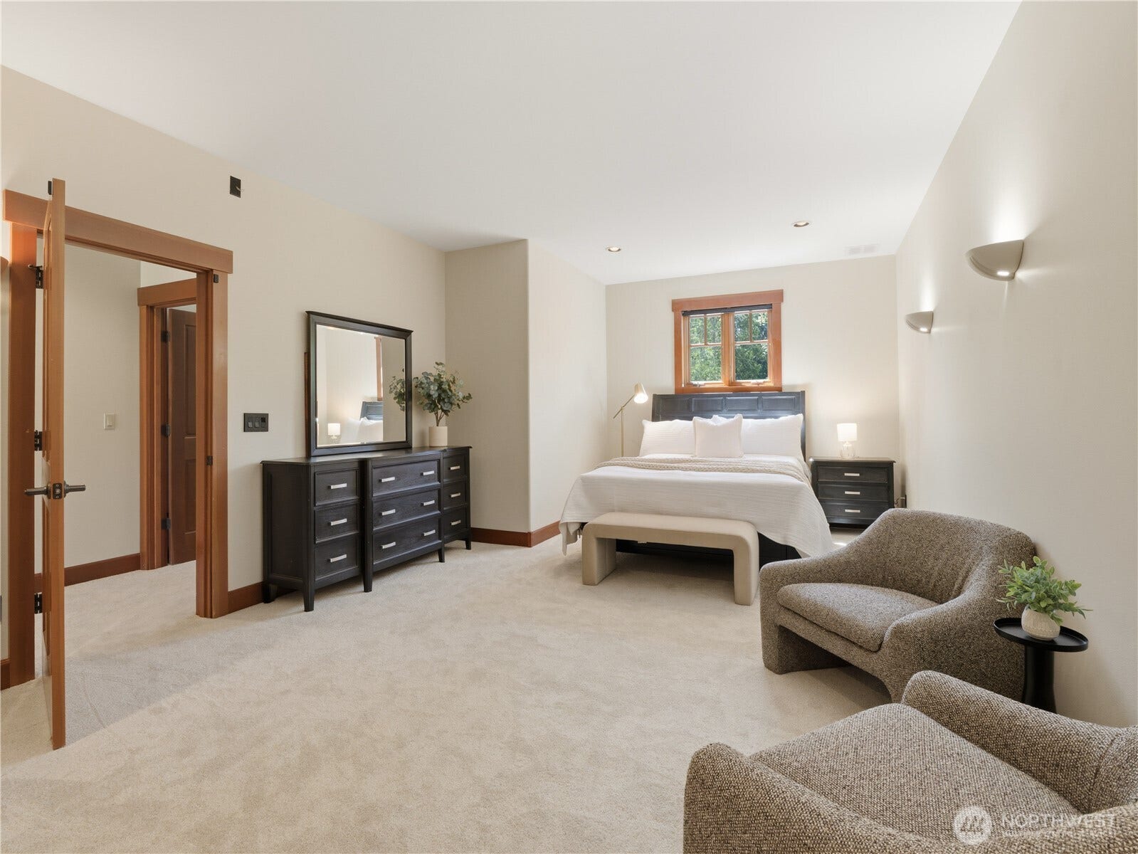 Generously sized bedroom with sitting area potential, abundant natural light, and a flexible layout designed for comfort and versatility.