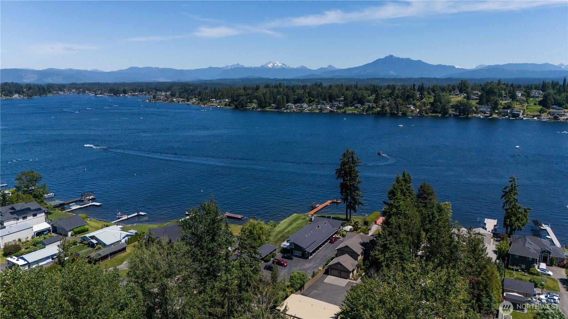 Panoramic views span Lake Stevens and the Cascade Mountains, creating an unforgettable backdrop for waterfront living.