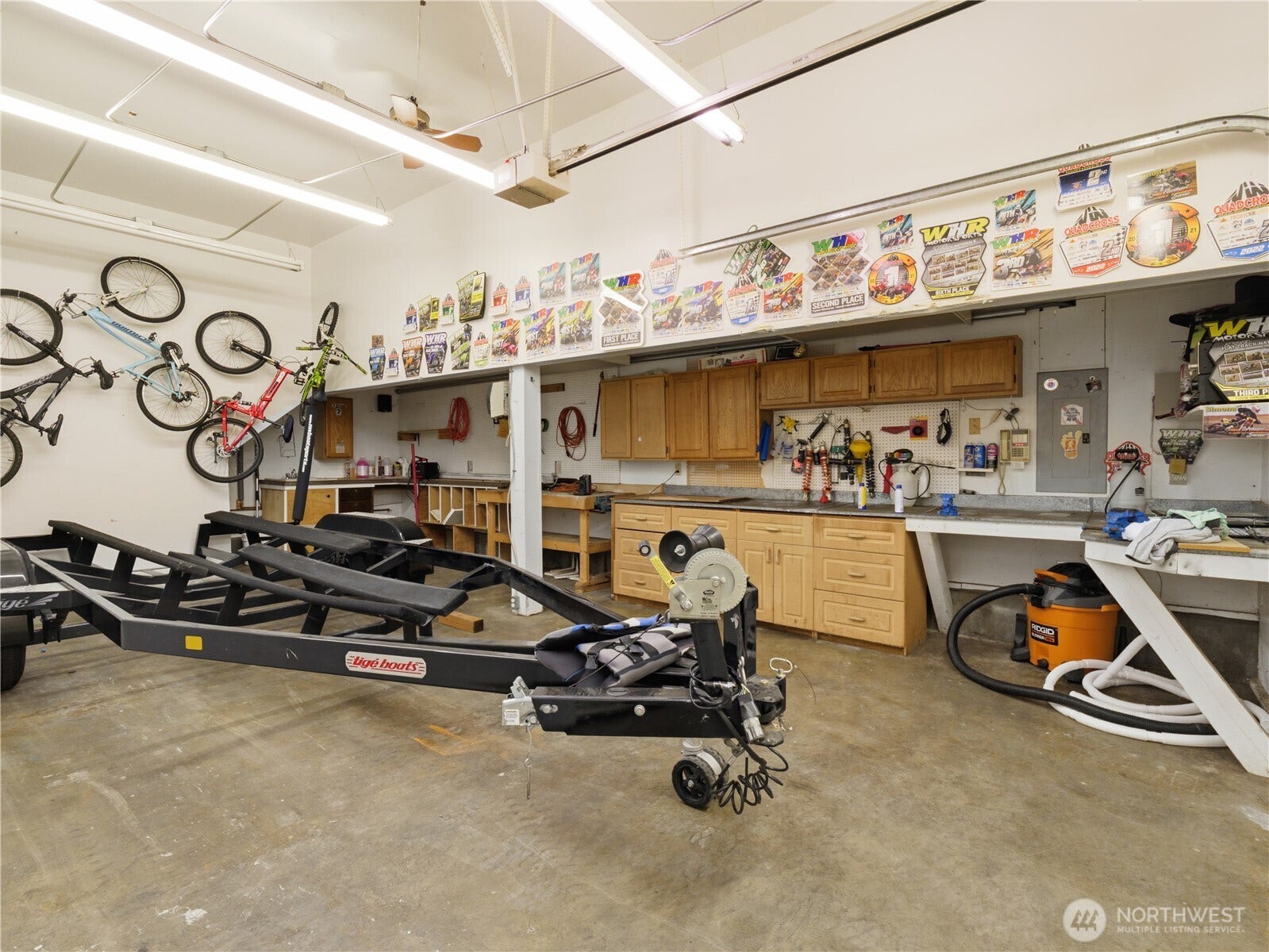 Waterfront living isn't just about the shoreline, it's about having the space to fully enjoy it. From boats and paddleboards to recreational equipment, projects, and storage, this substantial garage and shop provide the flexibility and functionality that make life at the lake effortless.
