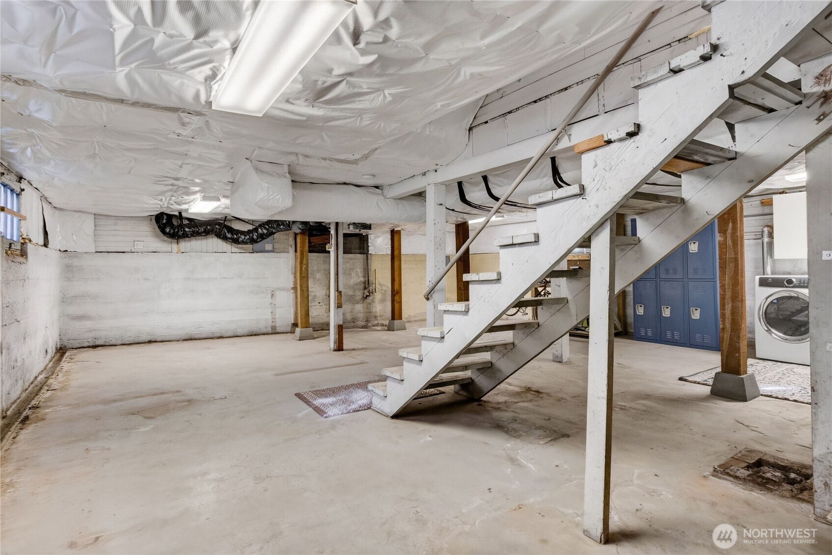 Unfinished basement with a separate entrance offers generous storage and future possibilities.