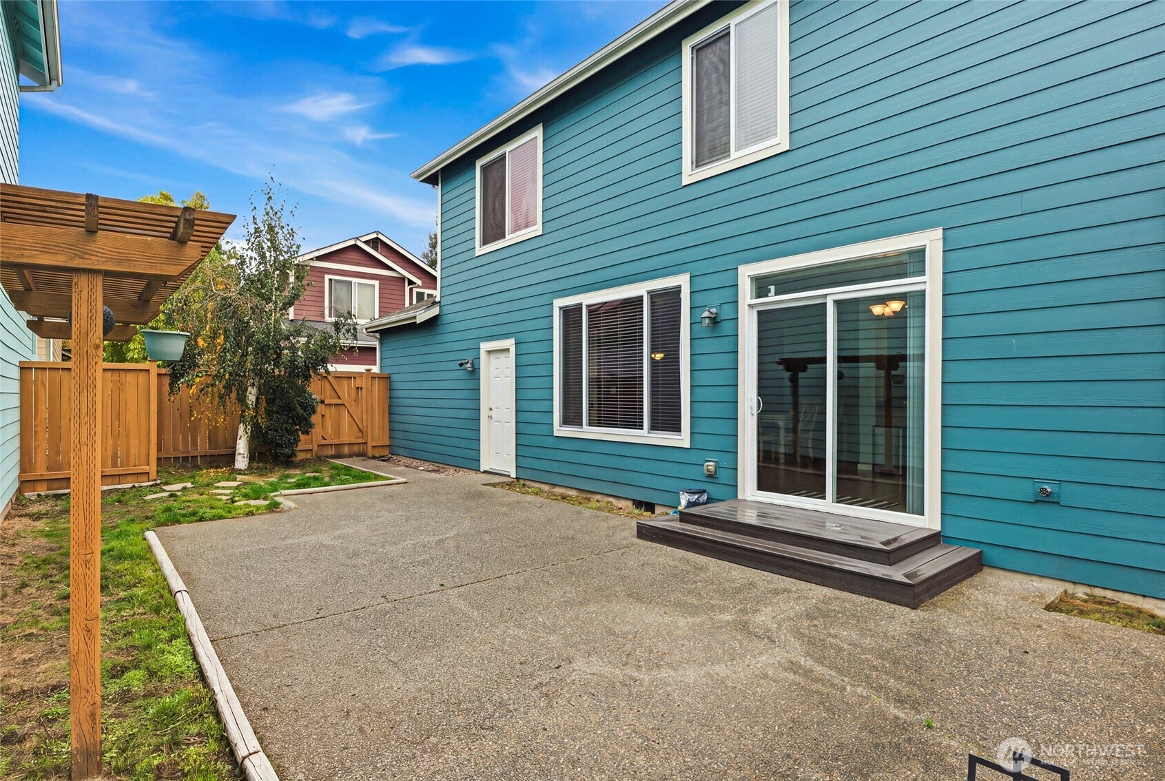 4628 Durham Street SE, Lacey, WA 98503 Fully fenced backyard with patio and some grass, made for grilling and golden-hour sunsets.