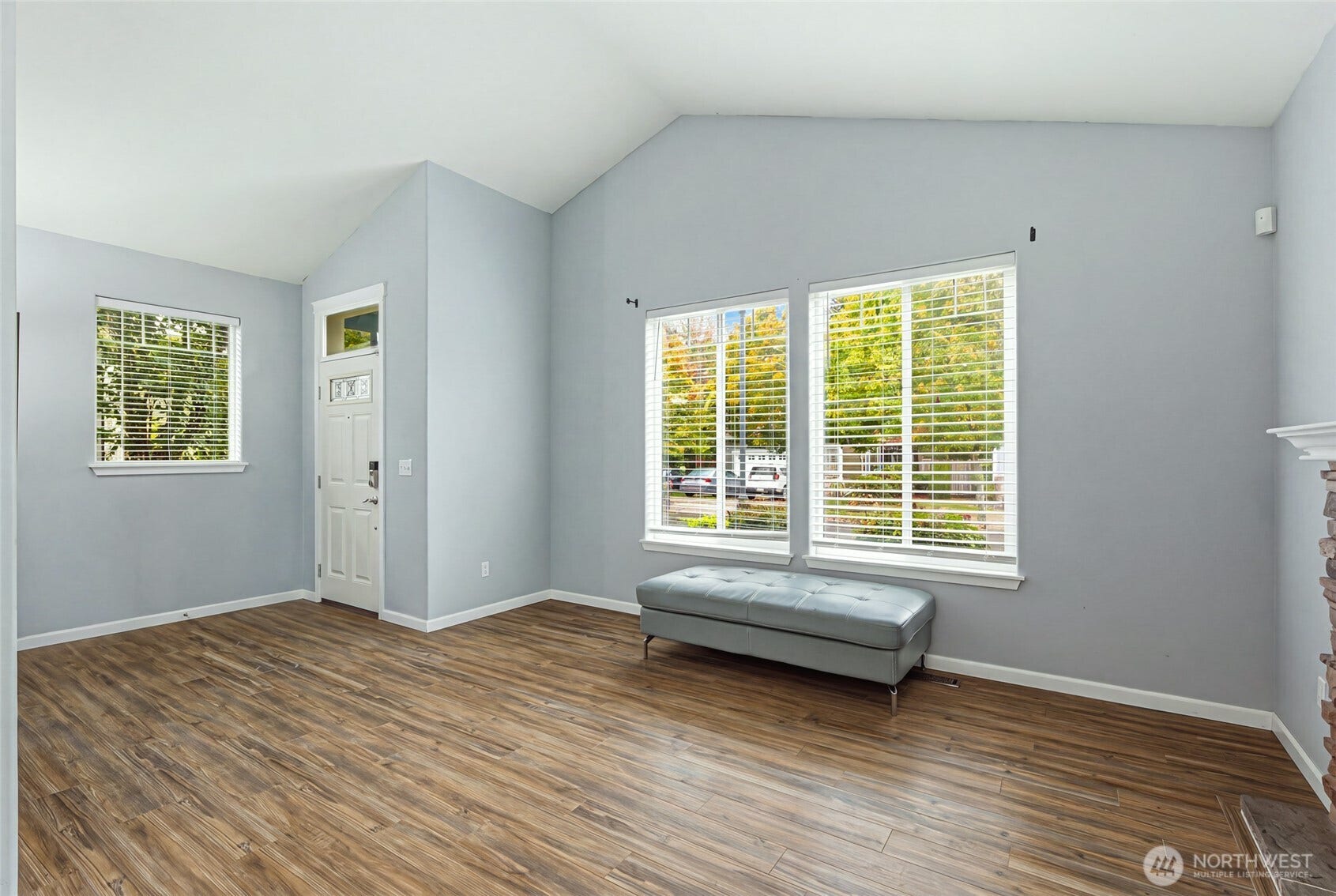 4628 Durham Street SE, Lacey, WA 98503 Bright main-level living space off the entry with vaulted ceilings and warm hardwood floors.