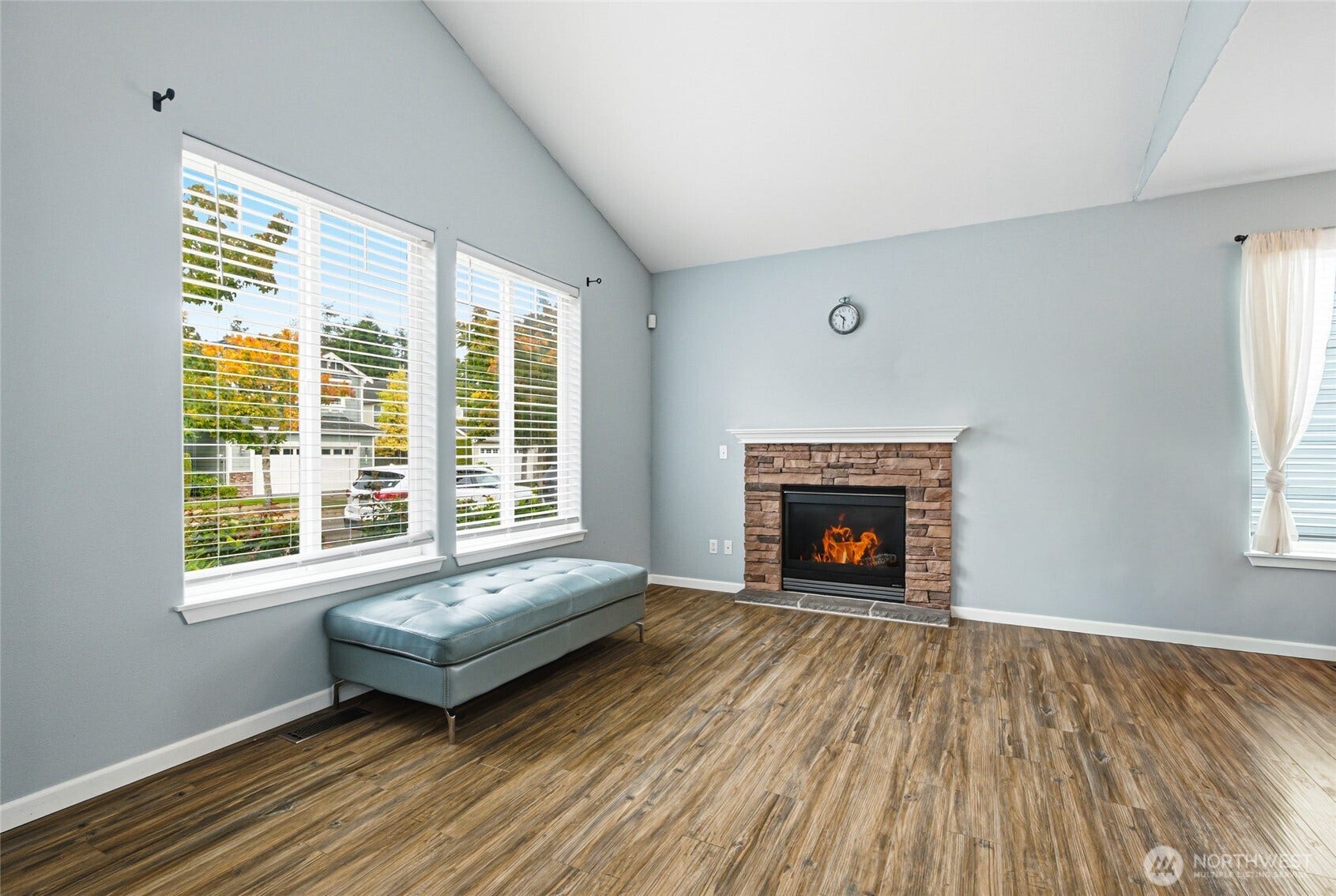 4628 Durham Street SE, Lacey, WA 98503 Enter into open living room with gas fireplace, vaulted ceilings, and new engineered hardwoods (2022).