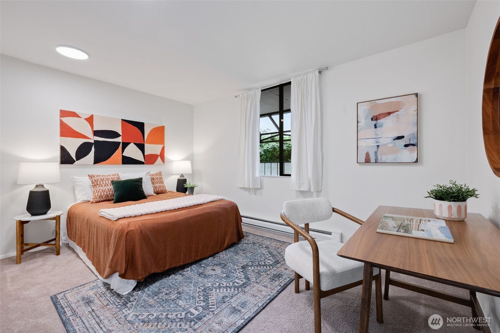 Second large bedroom with wall of closets.