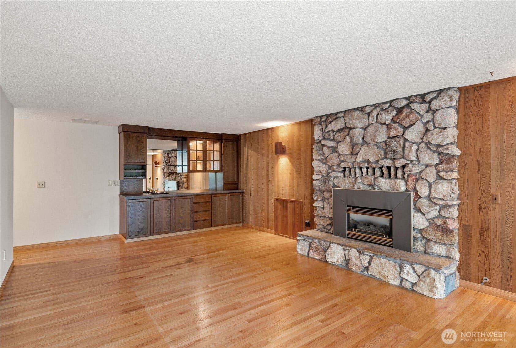 5628 139th Street NW, Gig Harbor, WA 98332 cozy den with wet bar and propane fireplace