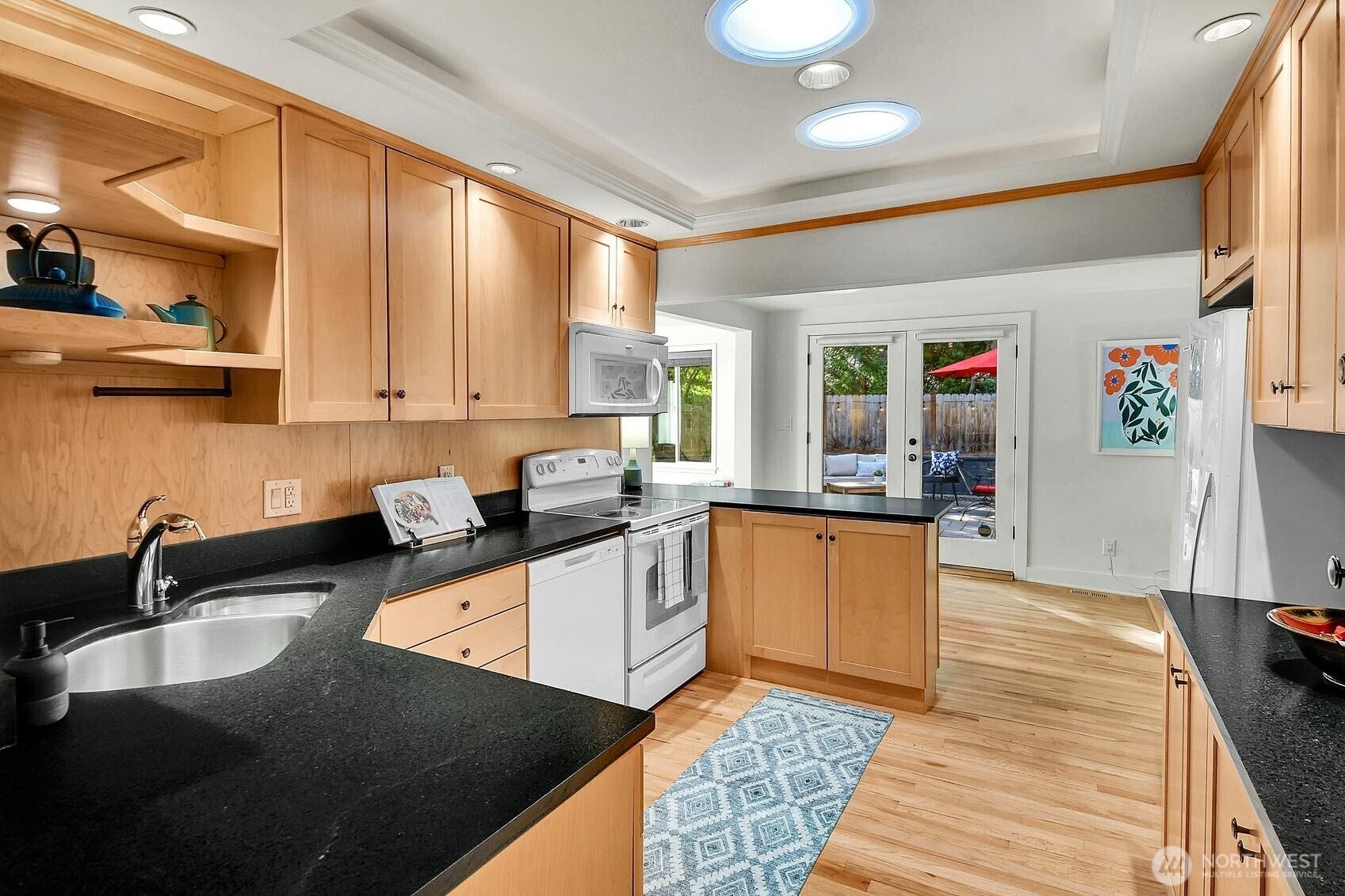 9013 25th Avenue NE, Seattle, WA 98115 The kitchen connects with all three livnig spaces.