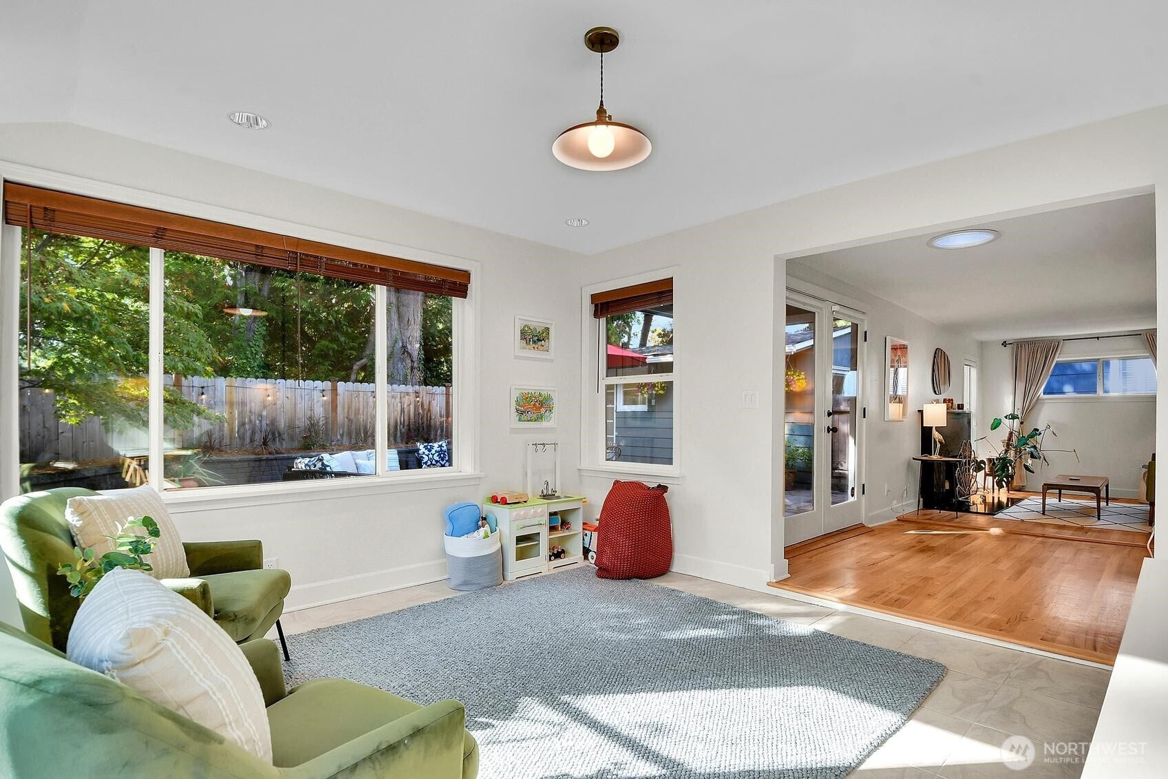 9013 25th Avenue NE, Seattle, WA 98115 Large sunroom with heated floors and two walls of windows. You'll never want to leave!