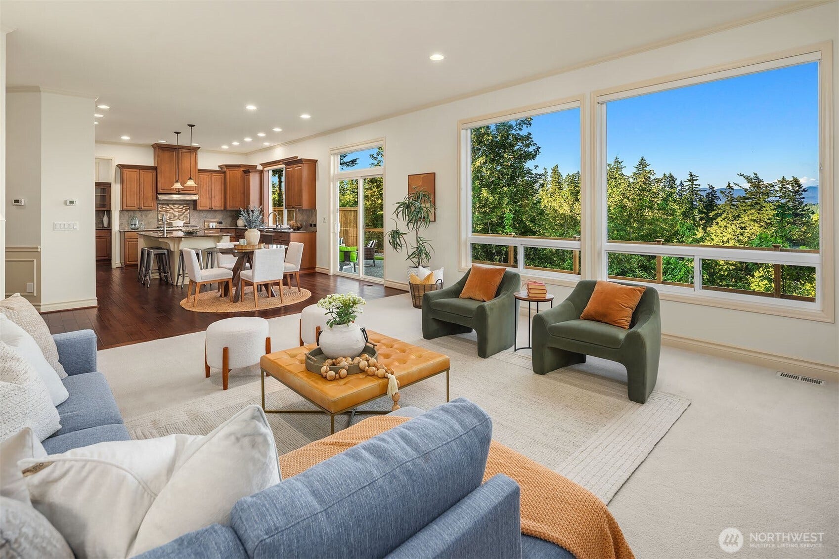 1836 273rd Place SE, Sammamish, WA 98075 Walls of windows bring the breathtaking Cascade Mountain views into the heart of the home.