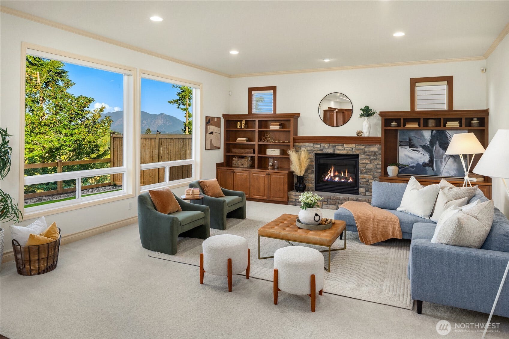 1836 273rd Place SE, Sammamish, WA 98075 Walls of windows fill the great room, while a stone fireplace & custom built-ins create an inviting focal point.