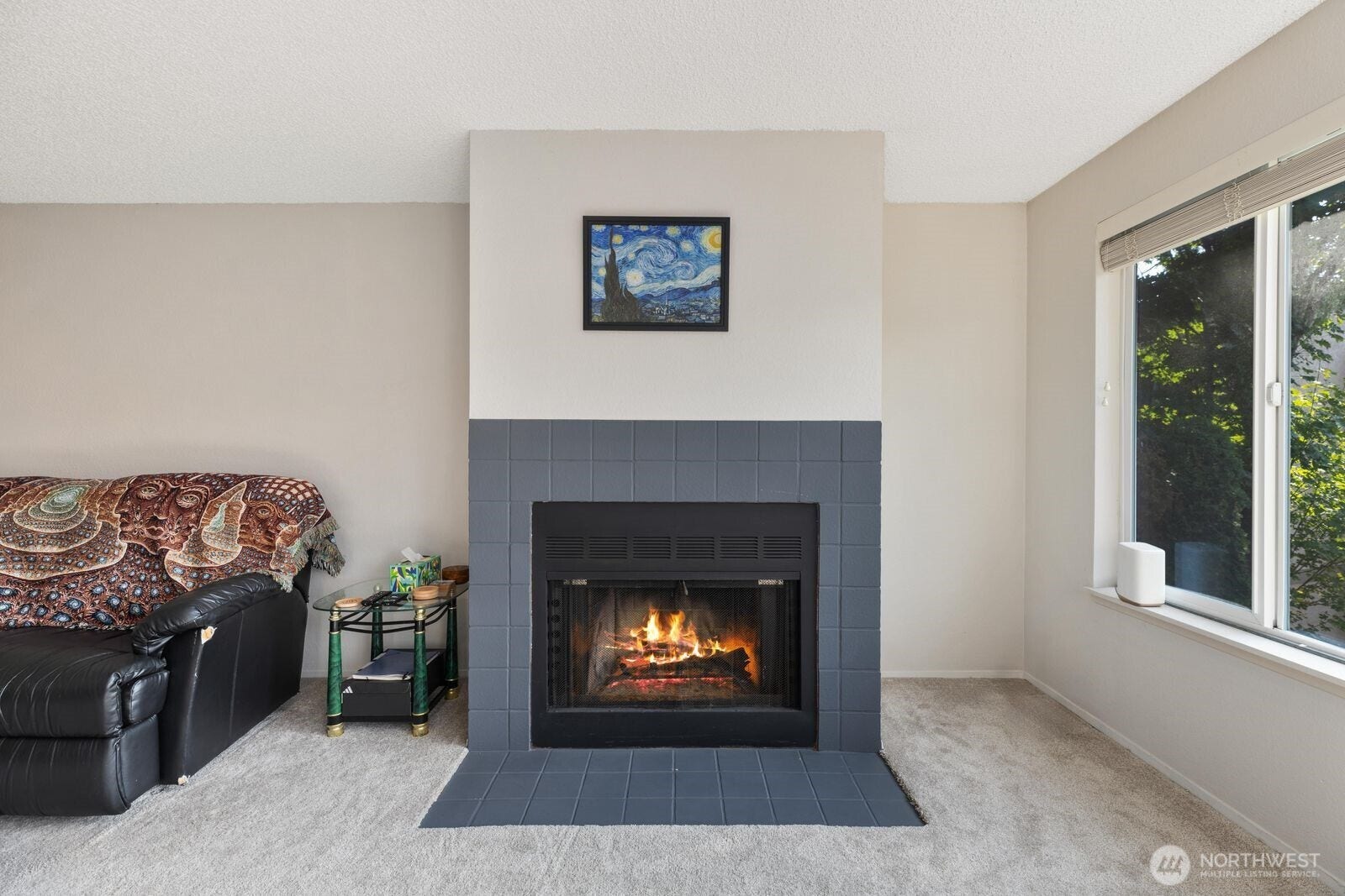 11802 98th Avenue NE, #B6, Kirkland, WA 98034 The spacious living room on the main level. The cozy wood burning fireplace is a wonderful bonus on those chilly winter days. Also ample natural lot which is a must in the Pacific Northwest!