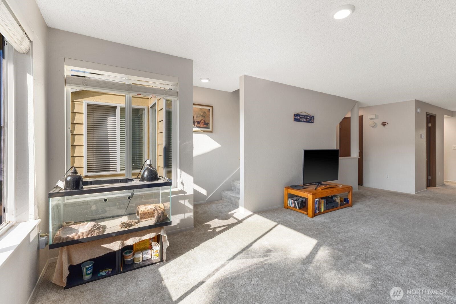 11802 98th Avenue NE, #B6, Kirkland, WA 98034 The spacious living room on the main level. The cozy wood burning fireplace is a wonderful bonus on those chilly winter days. Also ample natural lot which is a must in the Pacific Northwest!