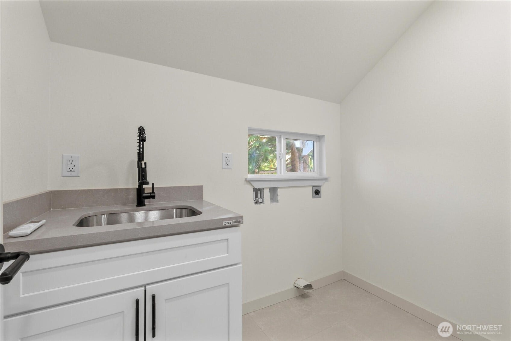 6706 Holly Place SW, Seattle, WA 98136 Upstairs laundry room. Secondary laundry room on lower level.
