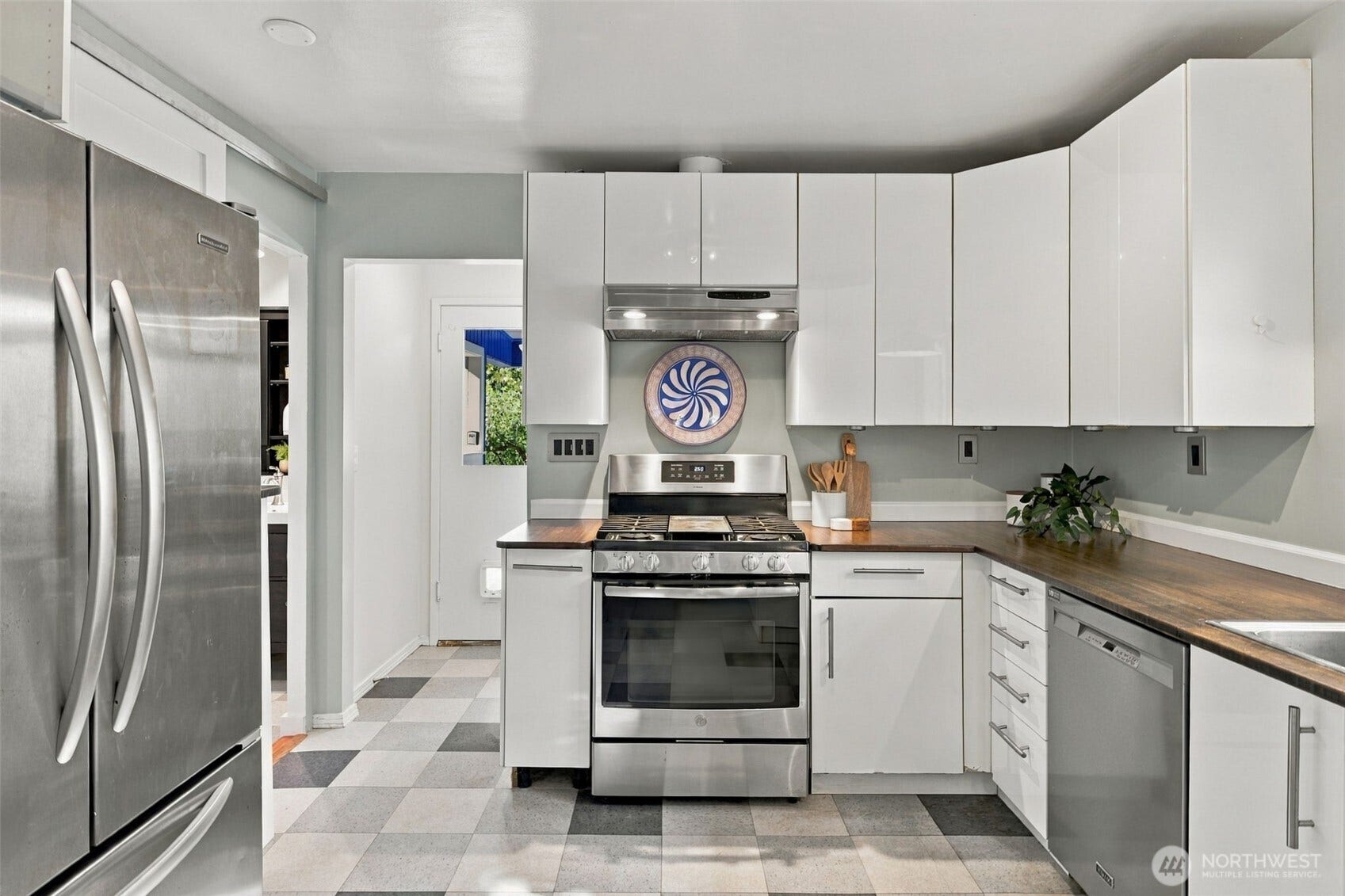 9051 2nd Avenue NW, Seattle, WA 98117 This kitchen has very efficient cabinet storage.