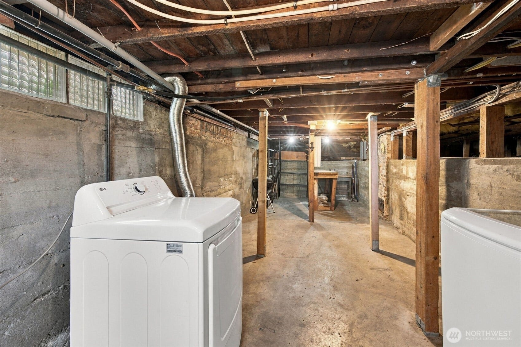 9051 2nd Avenue NW, Seattle, WA 98117 Laundry is in the basement with extra space for storage.