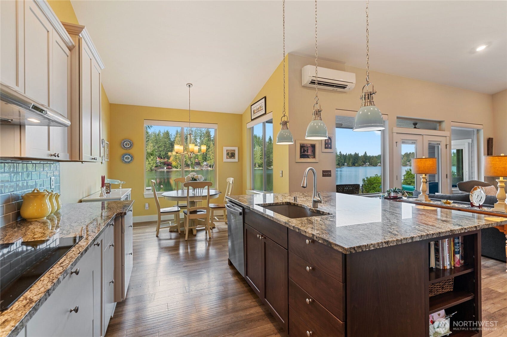 The kitchen flows smoothly into the dining nook and into the great room area.
