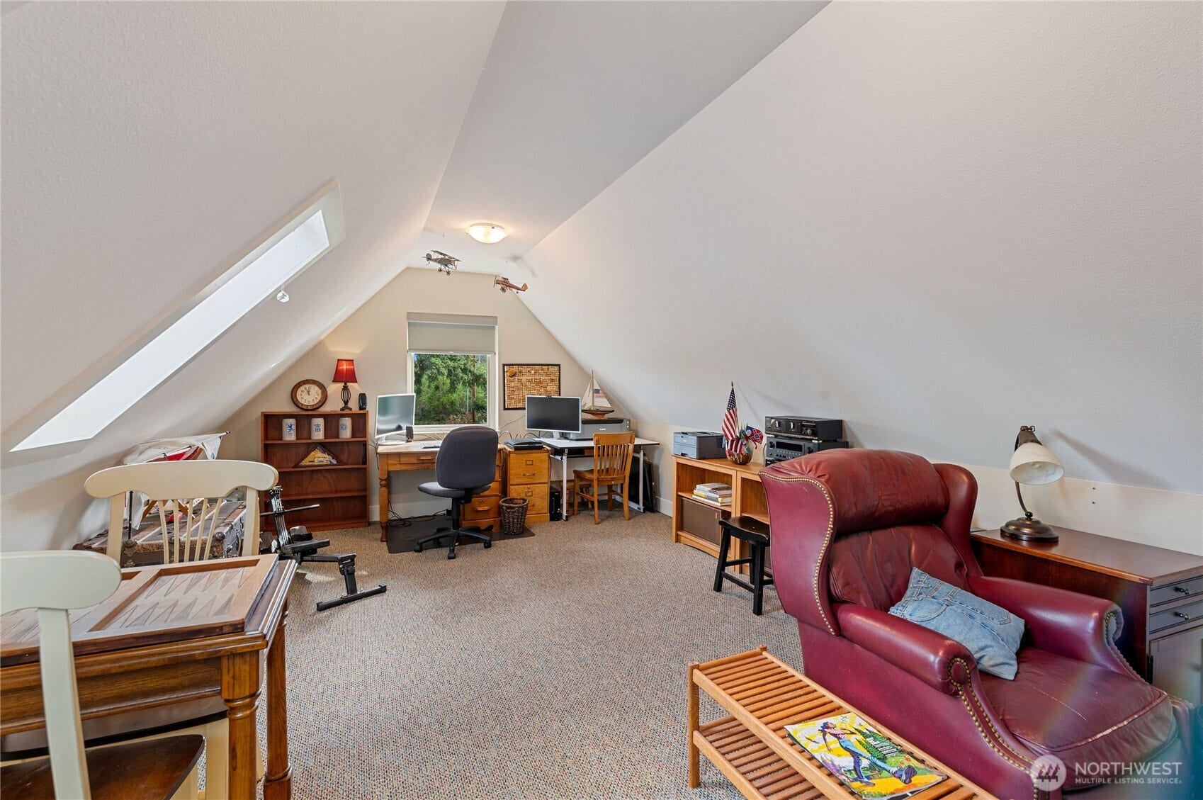 The bonus room above the garage is light and bright, a very cheery space to work.