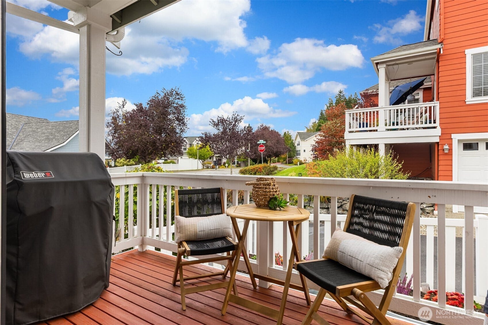 19800 Jensen Way NE, Poulsbo, WA 98370 A covered rear landing opens to the paved patio, creating an easy connection between the home and its inviting outdoor gathering space.