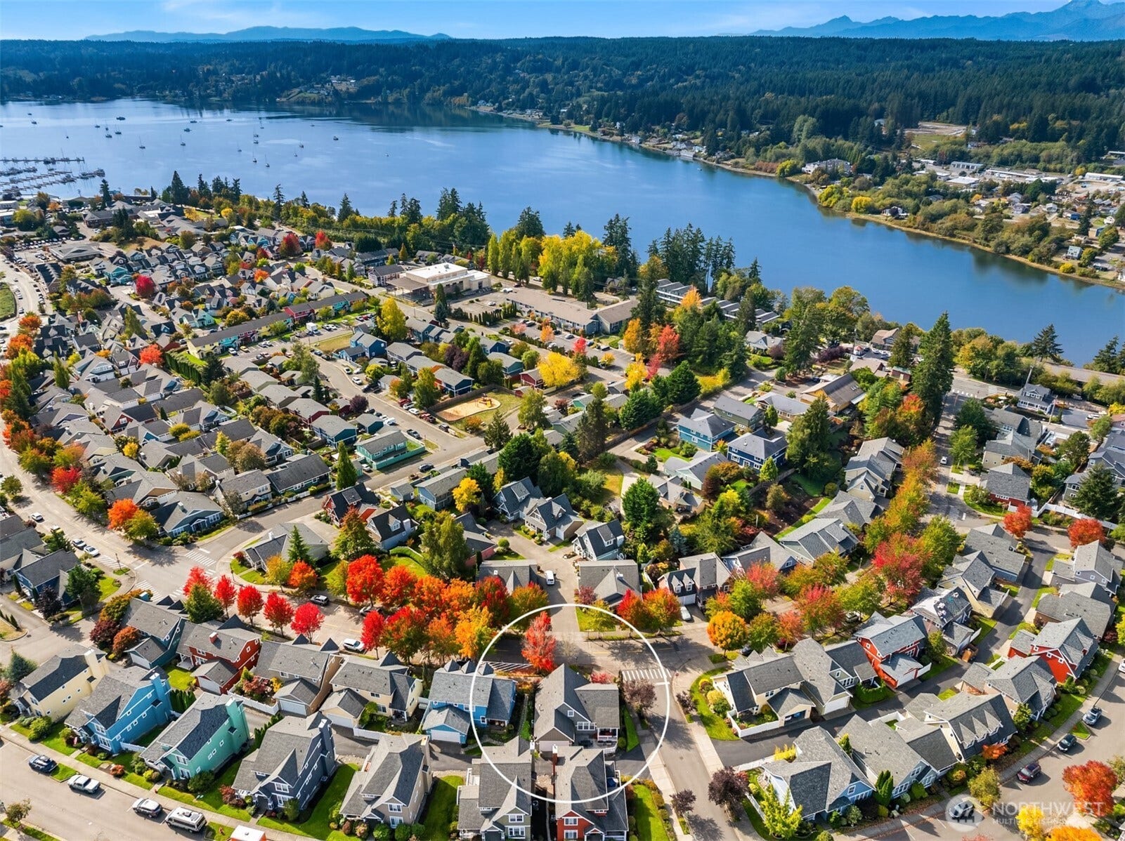 19800 Jensen Way NE, Poulsbo, WA 98370 Set amid tree-lined streets and established homes, the property enjoys a picturesque Poulsbo setting near Liberty Bay, with the Olympic Mountains visible in the distance.