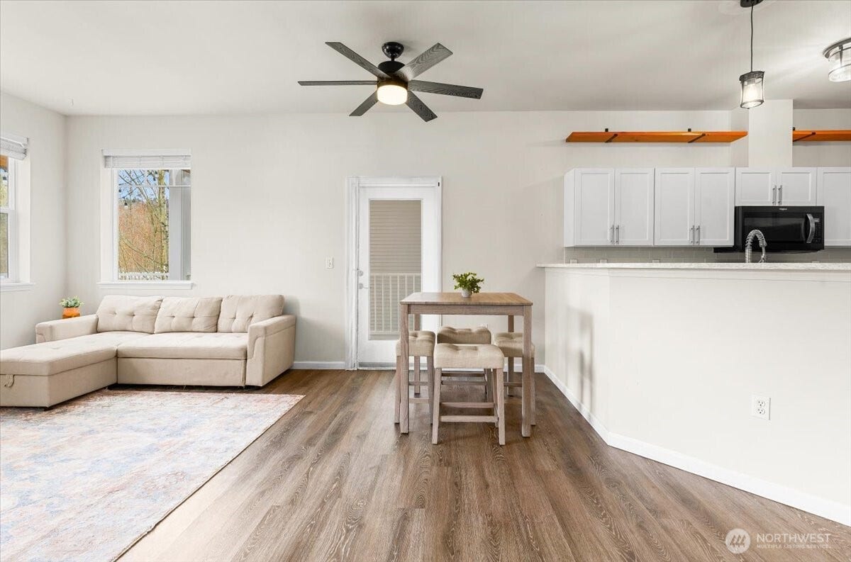 17426 Bothell Way NE, #A302, Bothell, WA 98011 Living-room, breakfast eating-nook and kitchen area. That door leads to the outside, wrap-around large entertain deck.