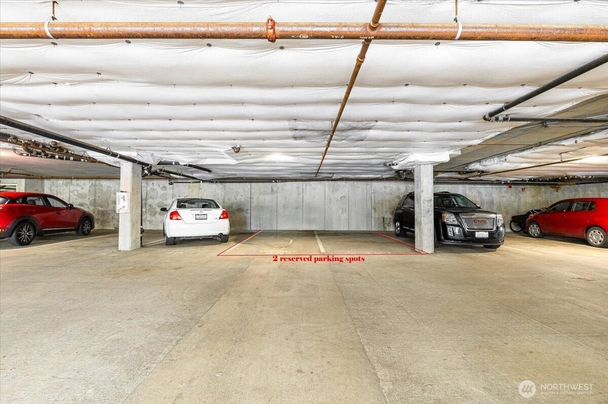 17426 Bothell Way NE, #A302, Bothell, WA 98011 Private, secure covered garage with two signed parking spaces. The kayak or canoe storage is close by.