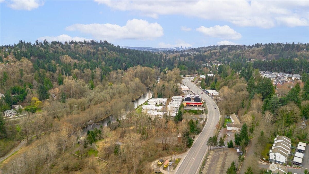 17426 Bothell Way NE, #A302, Bothell, WA 98011 You can see the Sammamish River which leads to the Lake Washington and Woodinville on the left of this photo and if you look carefully you can also see the Burke-Gilman Trail for biking or strolling that's adjacent to the river behind the white condominiums. Unit A302 is condominium for sale in building "A".