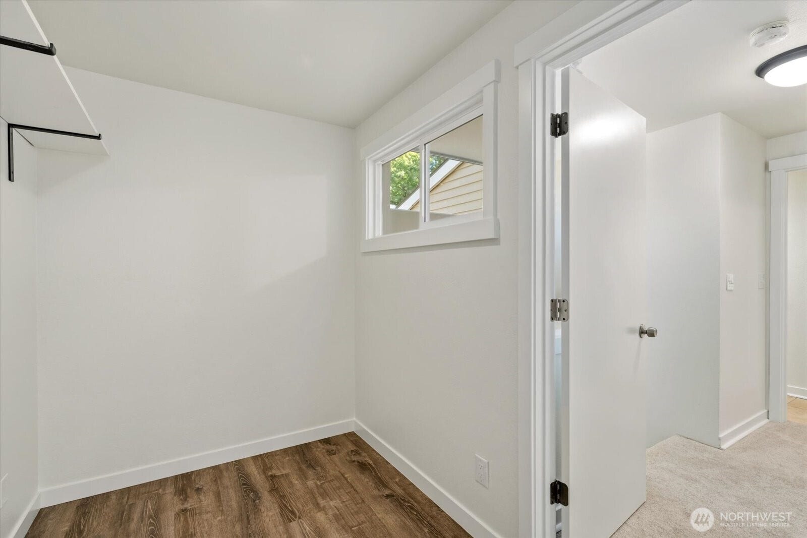 11411 102nd Court NE, Kirkland, WA 98033 With hallway access, this walk-in closet flexes easily into a home office or bonus space.