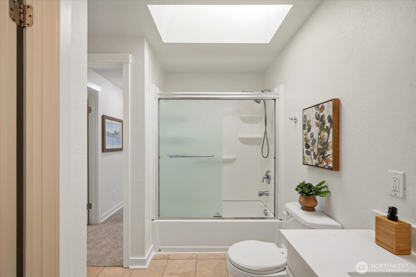 11411 102nd Court NE, Kirkland, WA 98033 A skylight fills drenches the bathroom with natural light!