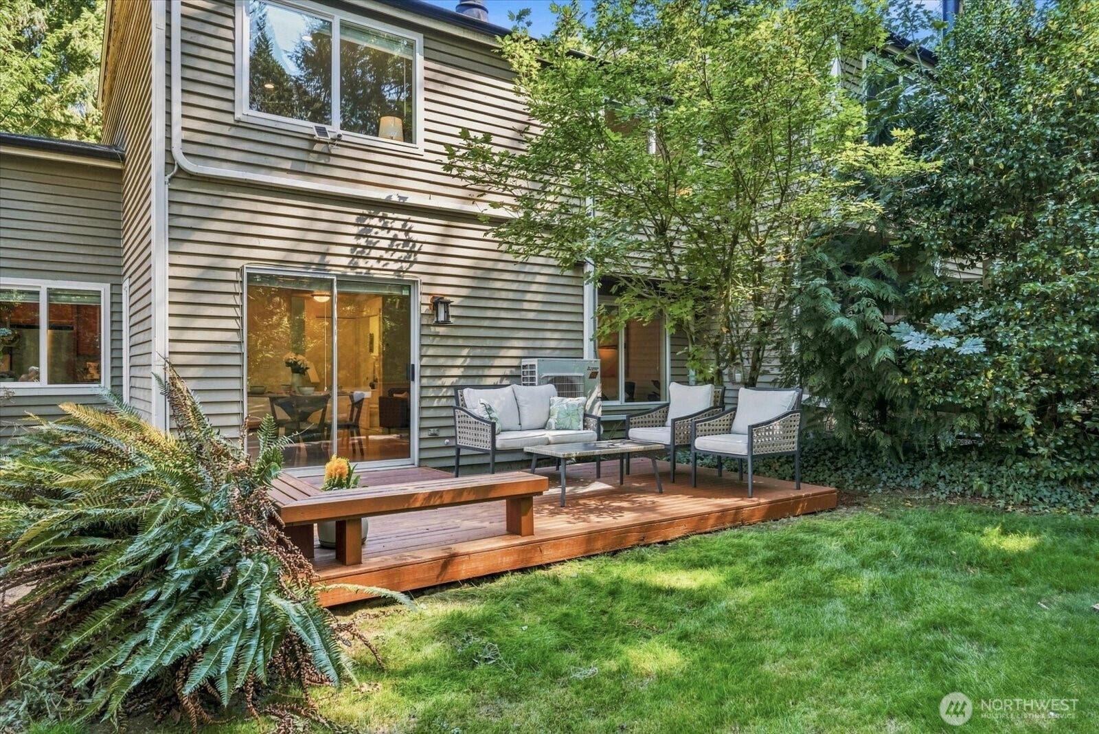 11411 102nd Court NE, Kirkland, WA 98033 Sliding doors connect the main level directly to the deck, creating an easy indoor-outdoor flow.