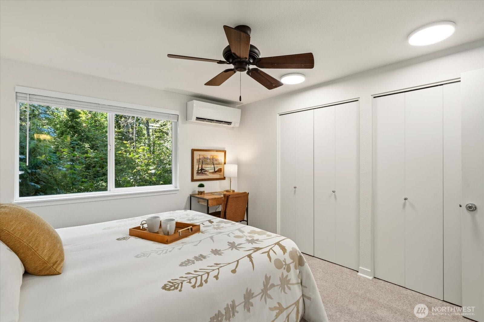 11411 102nd Court NE, Kirkland, WA 98033 Spacious primary bedroom features custom built-in closets.