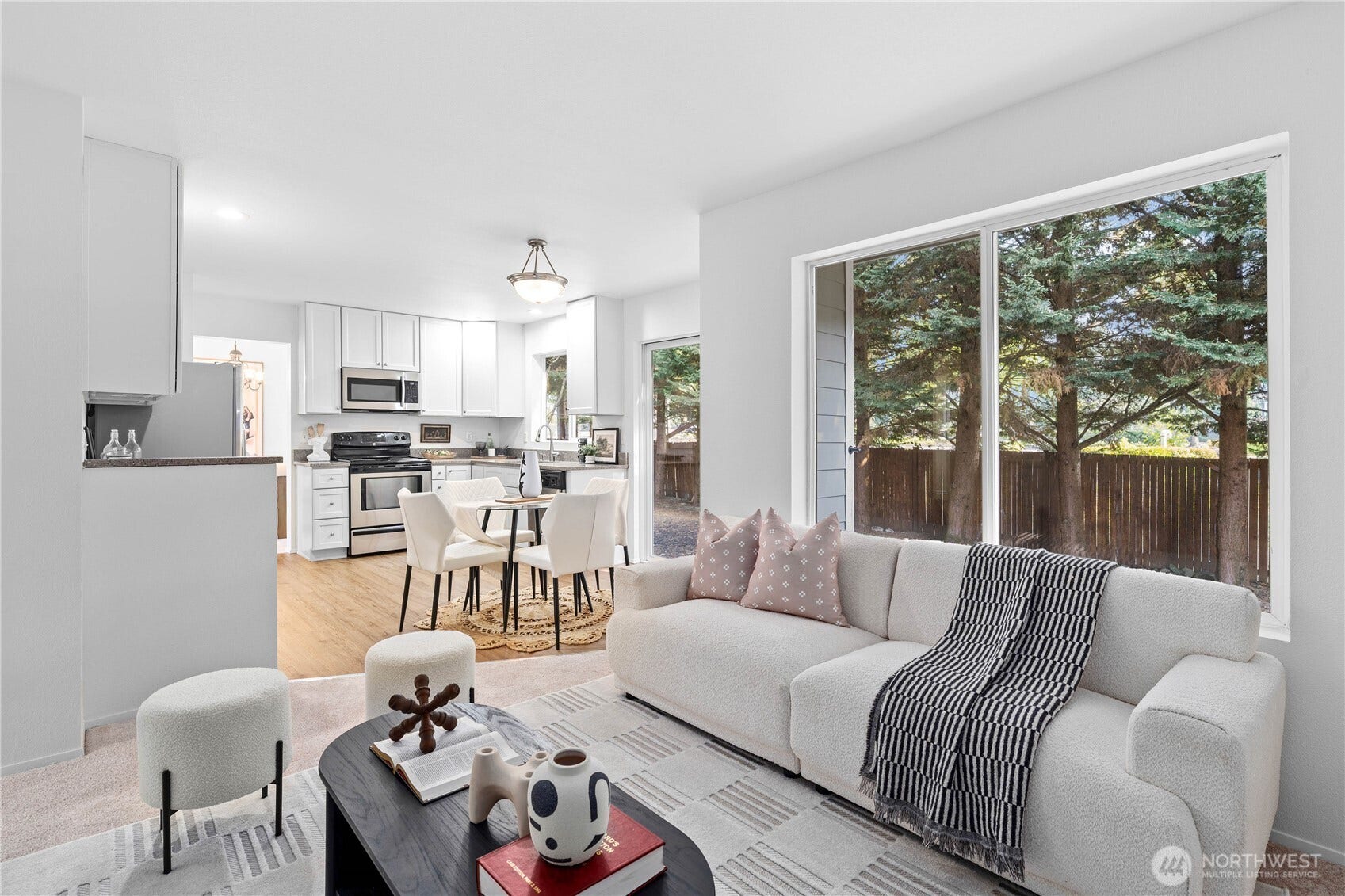 Peaceful views of the mature trees and backyard bring the outdoors into the family room.