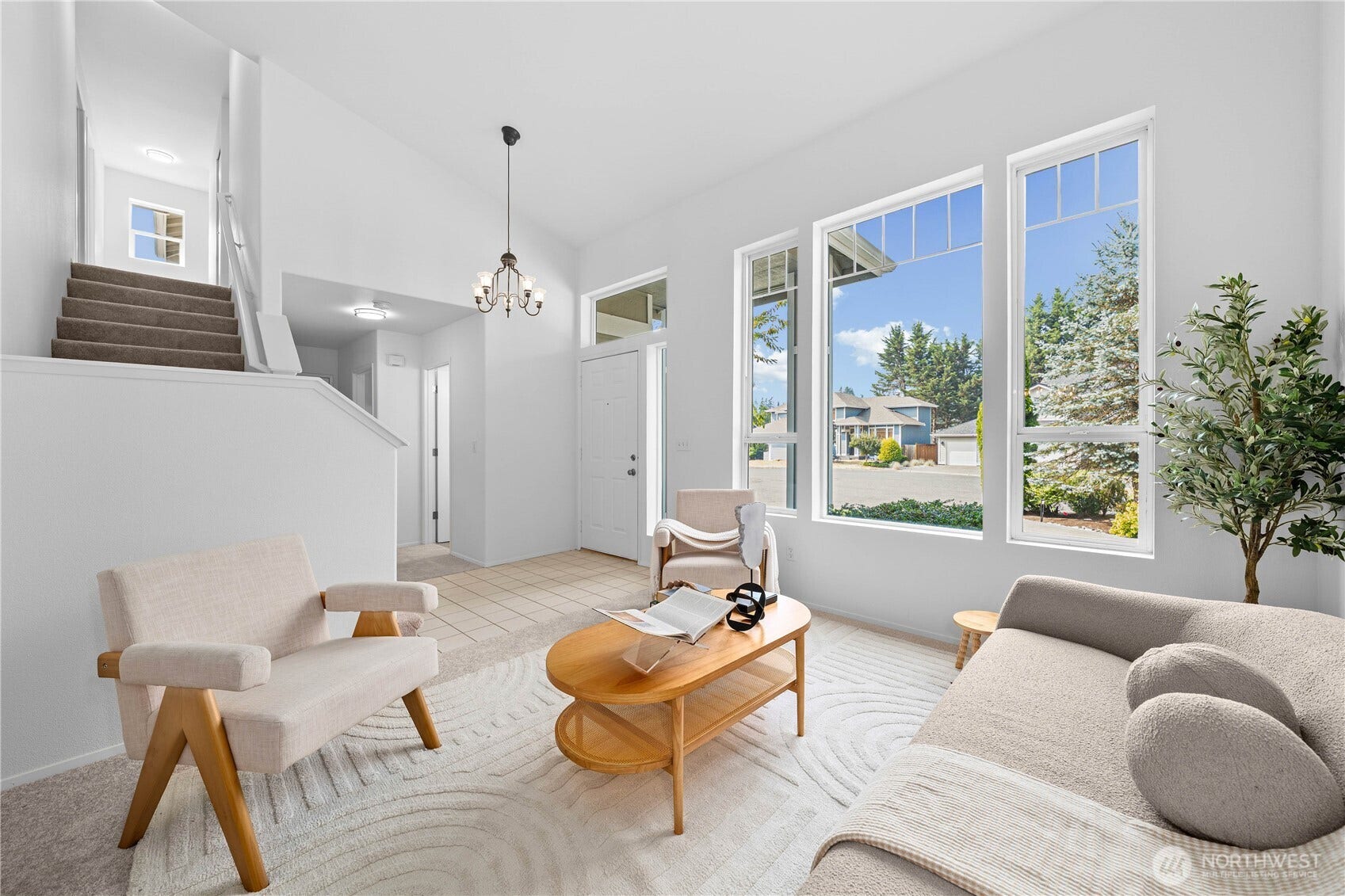 The living room features a wall of windows, all double pane, white vinyl for energy efficiency!