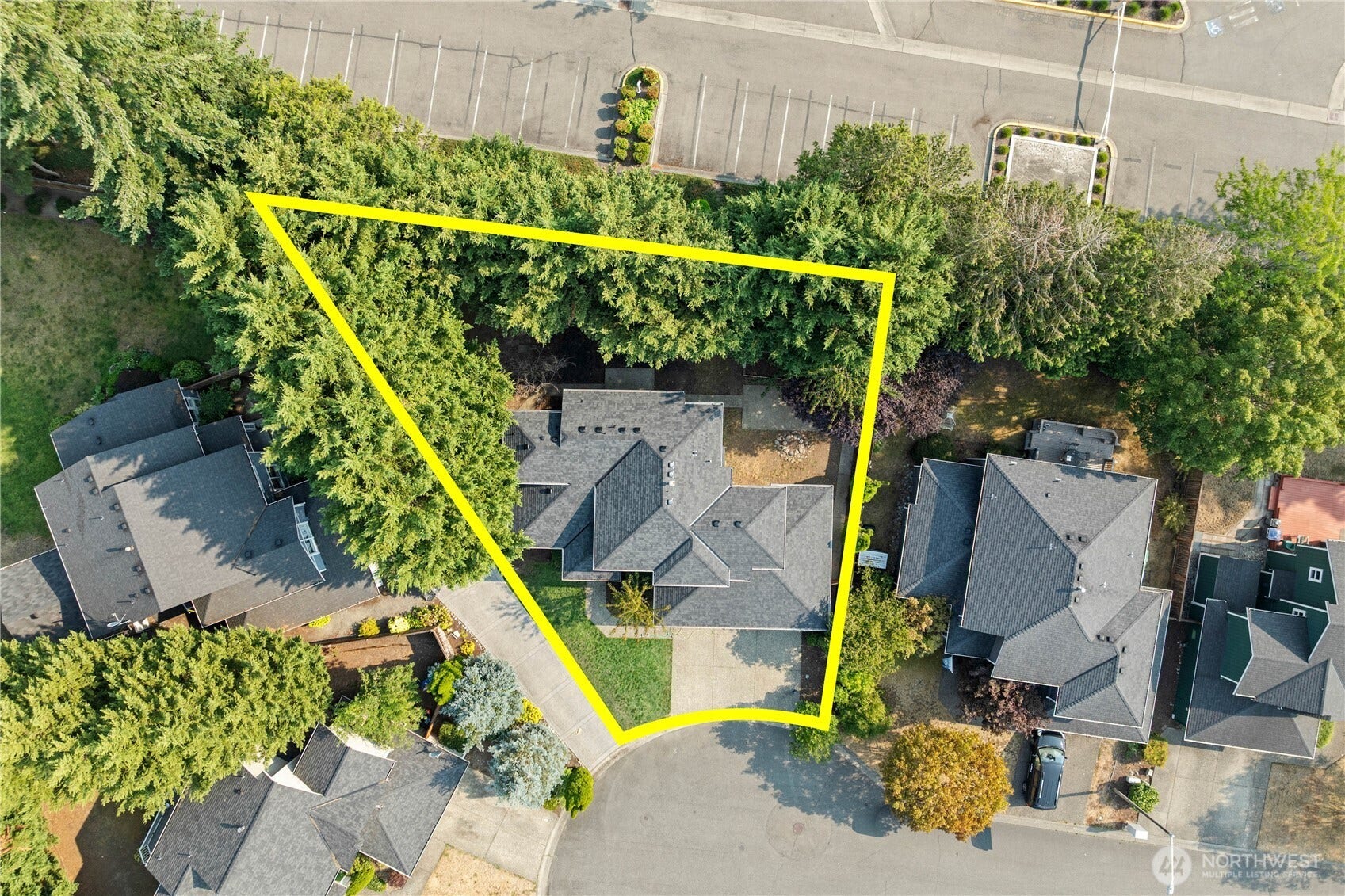 The home backs up to a church parking lot so you have privacy in back! The back yard is both private and level and features a row of mature trees with a fence behind it, providing you with a hidden oasis out the   back!