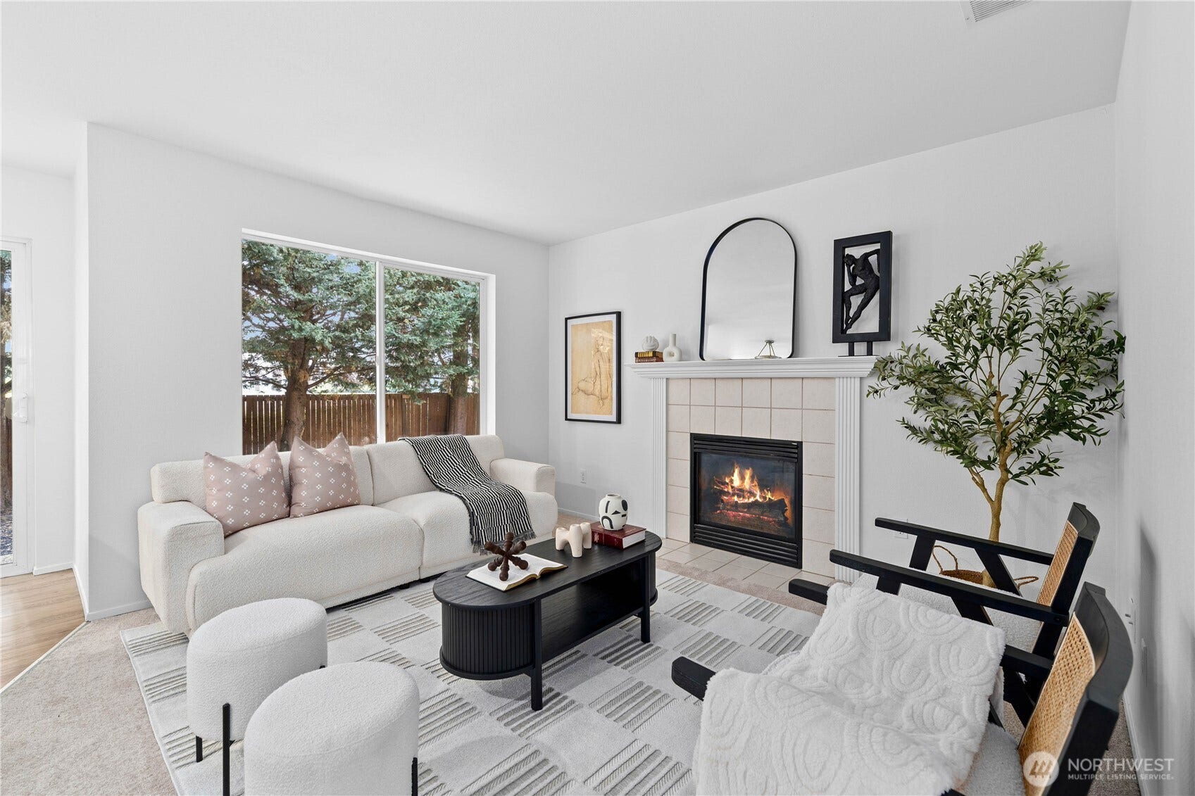 The family room features large picture windows and ample seating for the whole gang! Notice the tiled hearth that surrounds the gas fireplace that coordinates with the front entrance's tile. You are going to love it   here!
