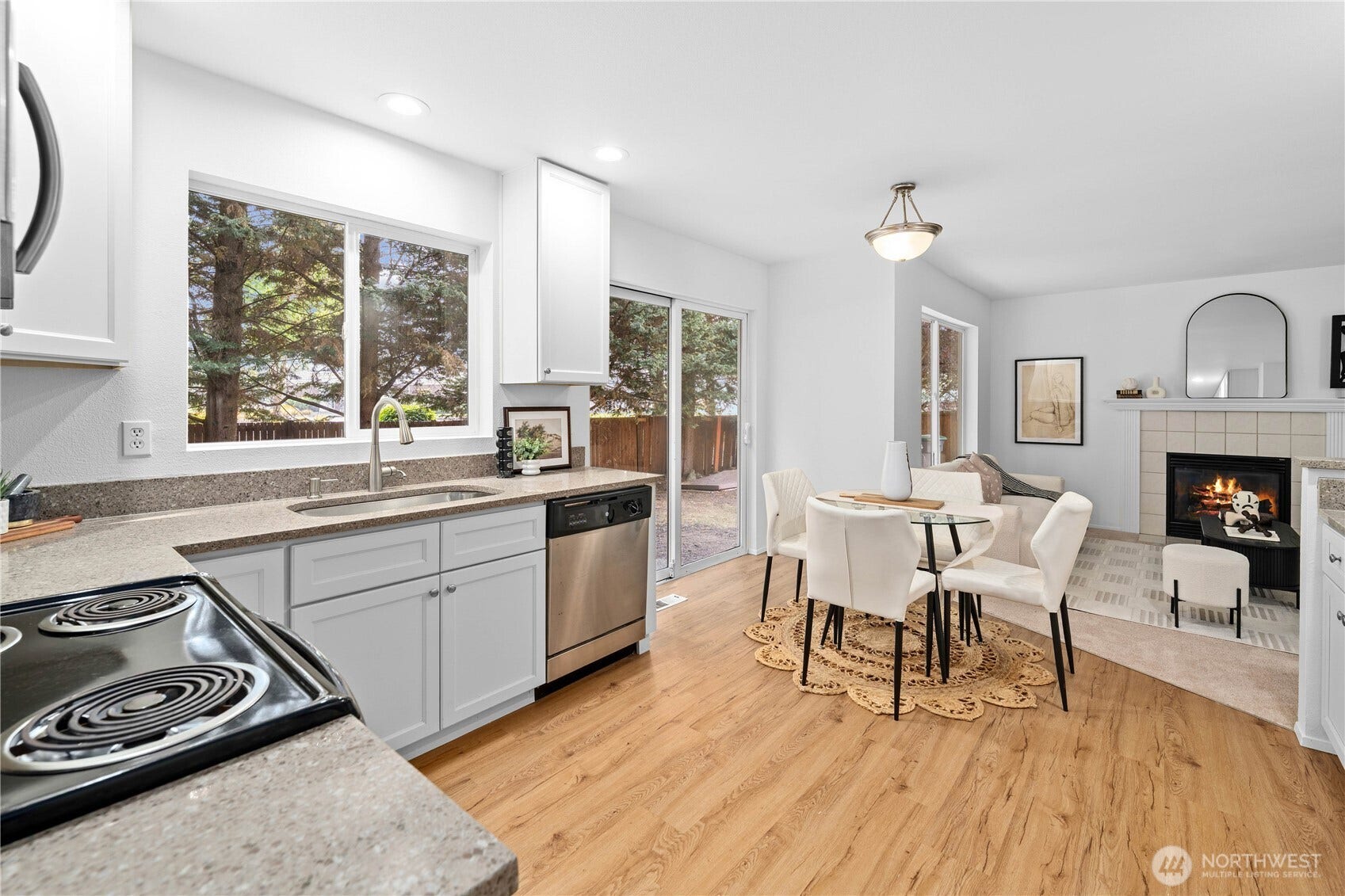 The kitchen was completely remodeled in the last couple years. New cabinets, new recessed stainless steel sink and faucet, new quartz counter tops, new flooring!
