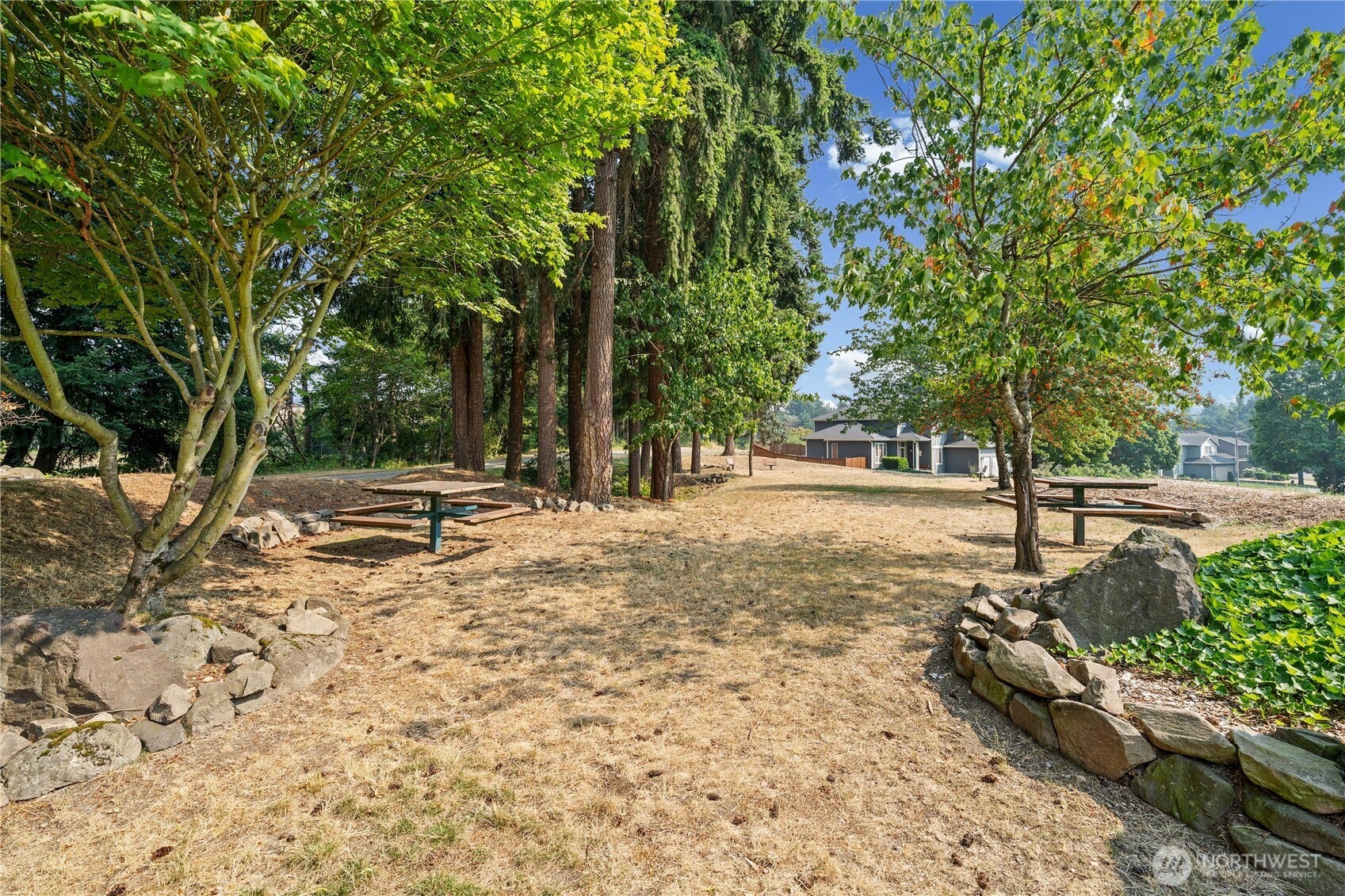 The neighborhood of Wilderness Summit includes a community park featuring built-in picnic table, room to play, mature trees for lots of shade AND access to the walking trails!
