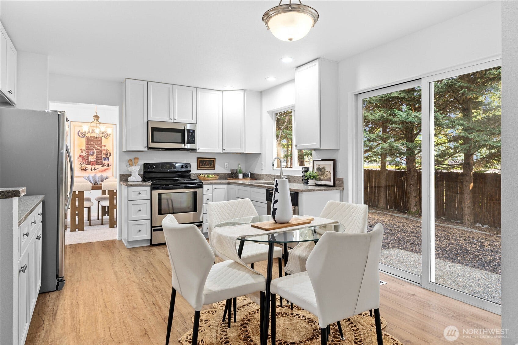 The large sliding glass door brings in a ton of natural light. Enjoy privacy as you look out into your level back yard.