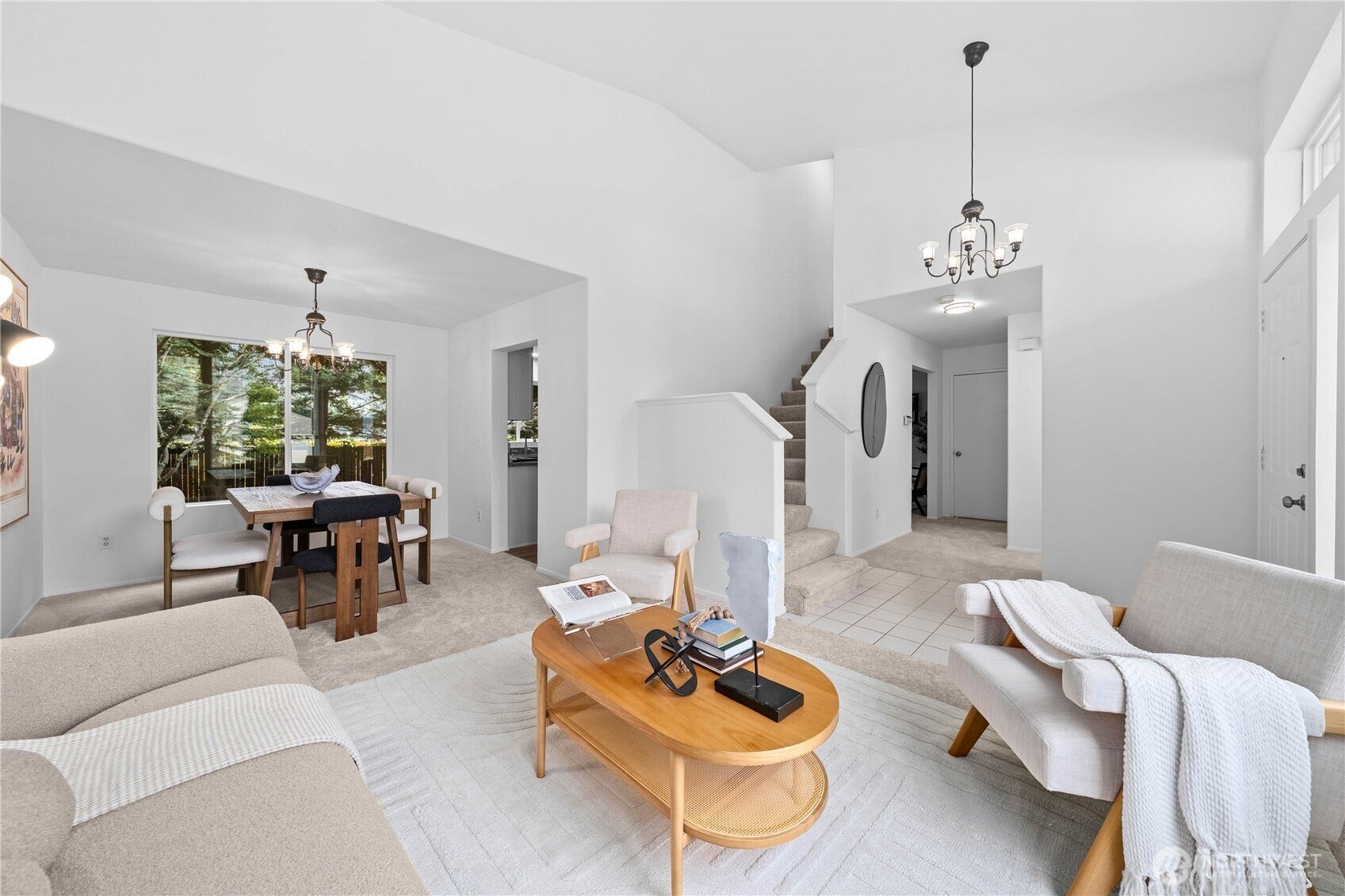 The dramatic, tall entrance sets the stage for this grand home. Open living room to dining room layout provides you the flexibility to expand are contract each space depending on the evening's plans.
