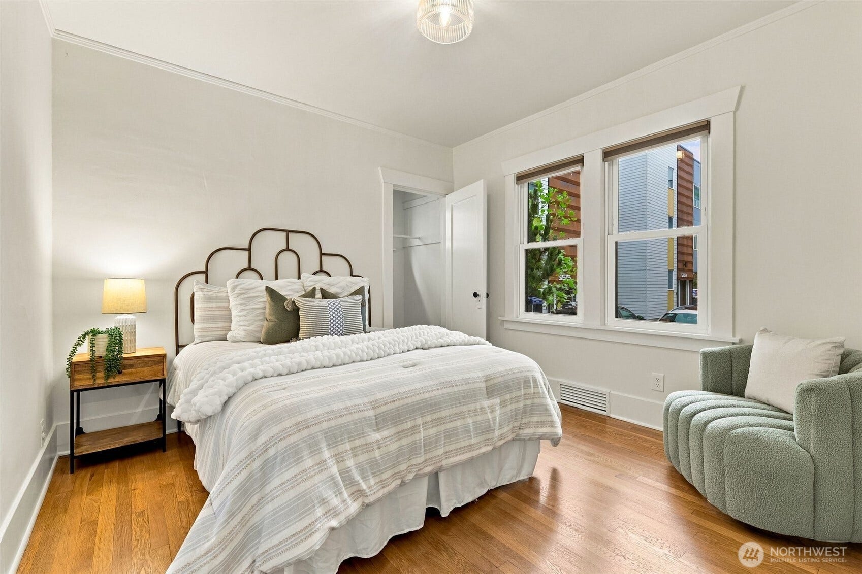 Second main floor bedroom with closet and built in storage.