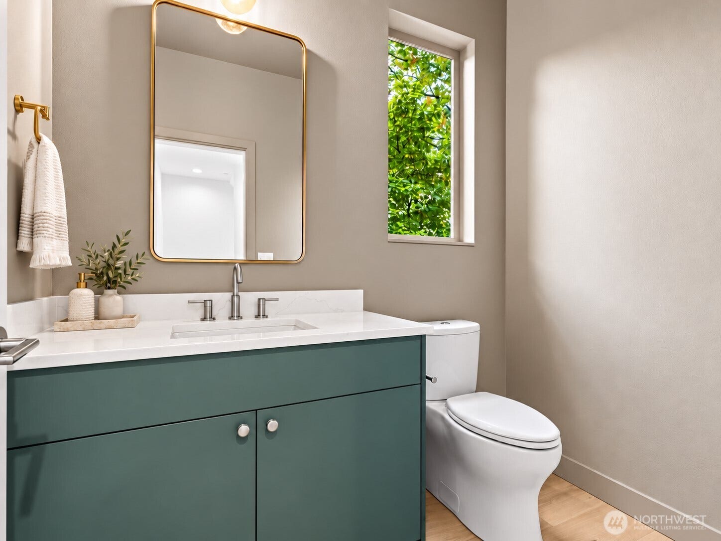 309 NW 52nd Street, Seattle, WA 98107 Powder room on main level. virtual staged