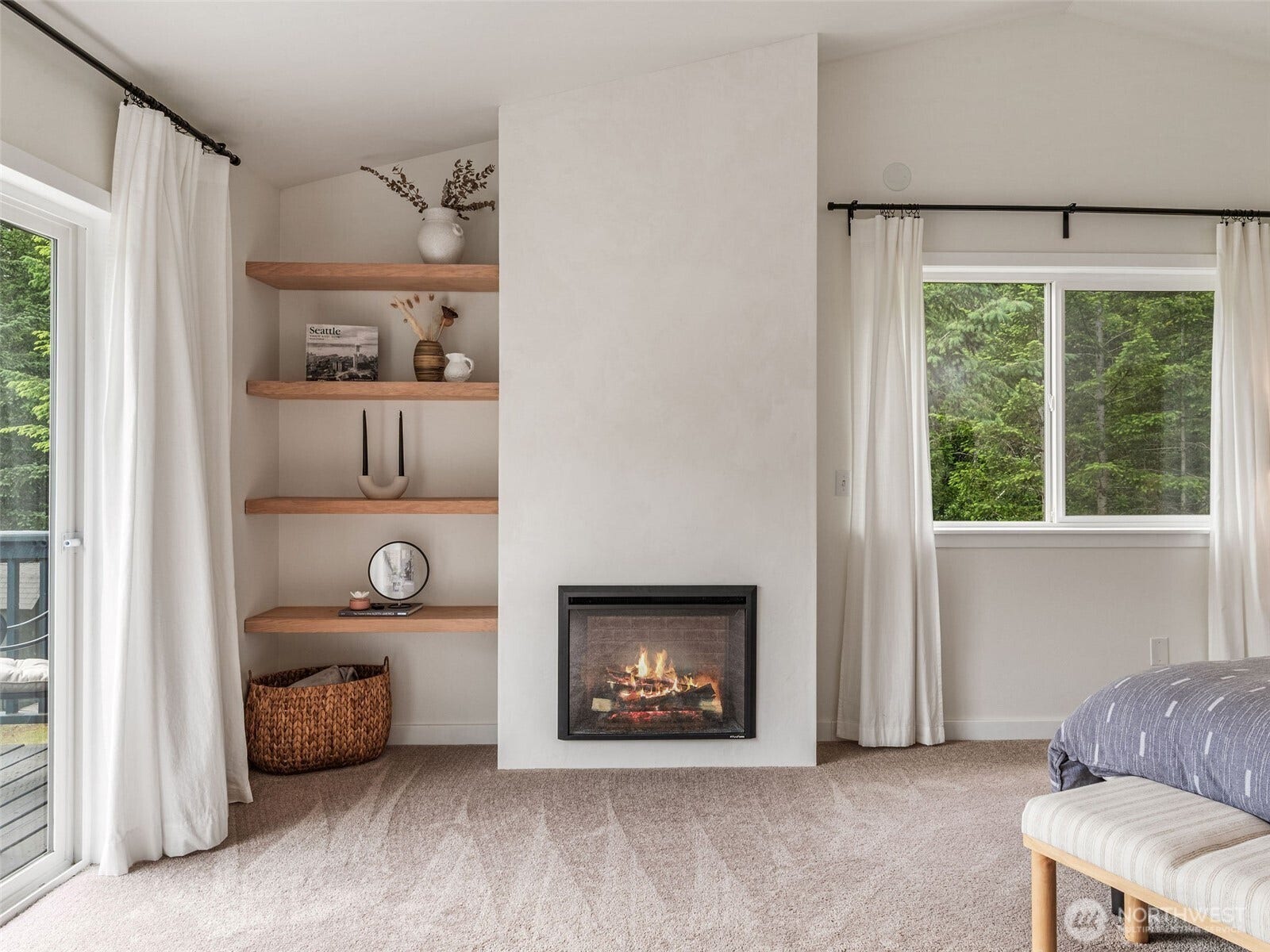 Electric fireplace in primary bedroom