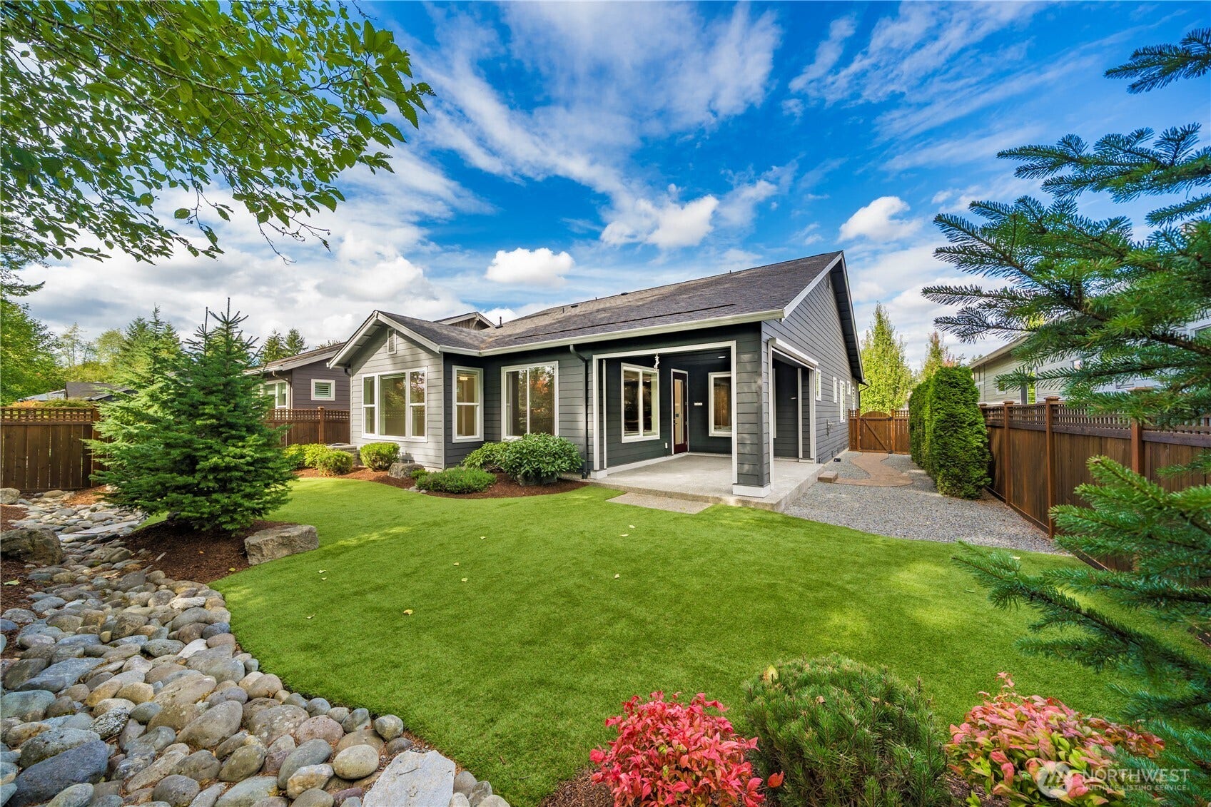 19014 146th Street E, Bonney Lake, WA 98391 The beautiful backyard offers high-grade turn and an easy care backyard. The generous covered patio also has a motorized sun/privacy screen.