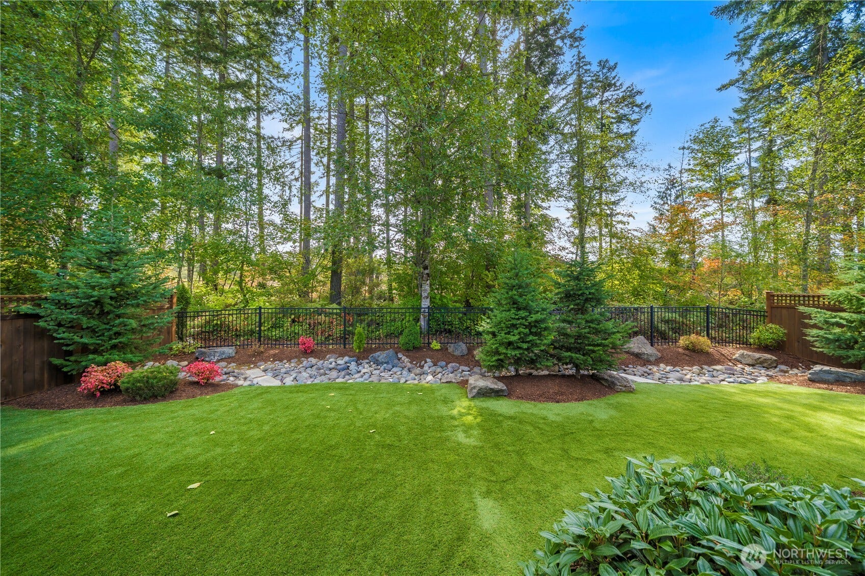 19014 146th Street E, Bonney Lake, WA 98391 The generous backyard backs up to a permanent 100' greenspace. High-grade turf, fully fenced and low maintenance landscaping presents a lovely backdrop!
