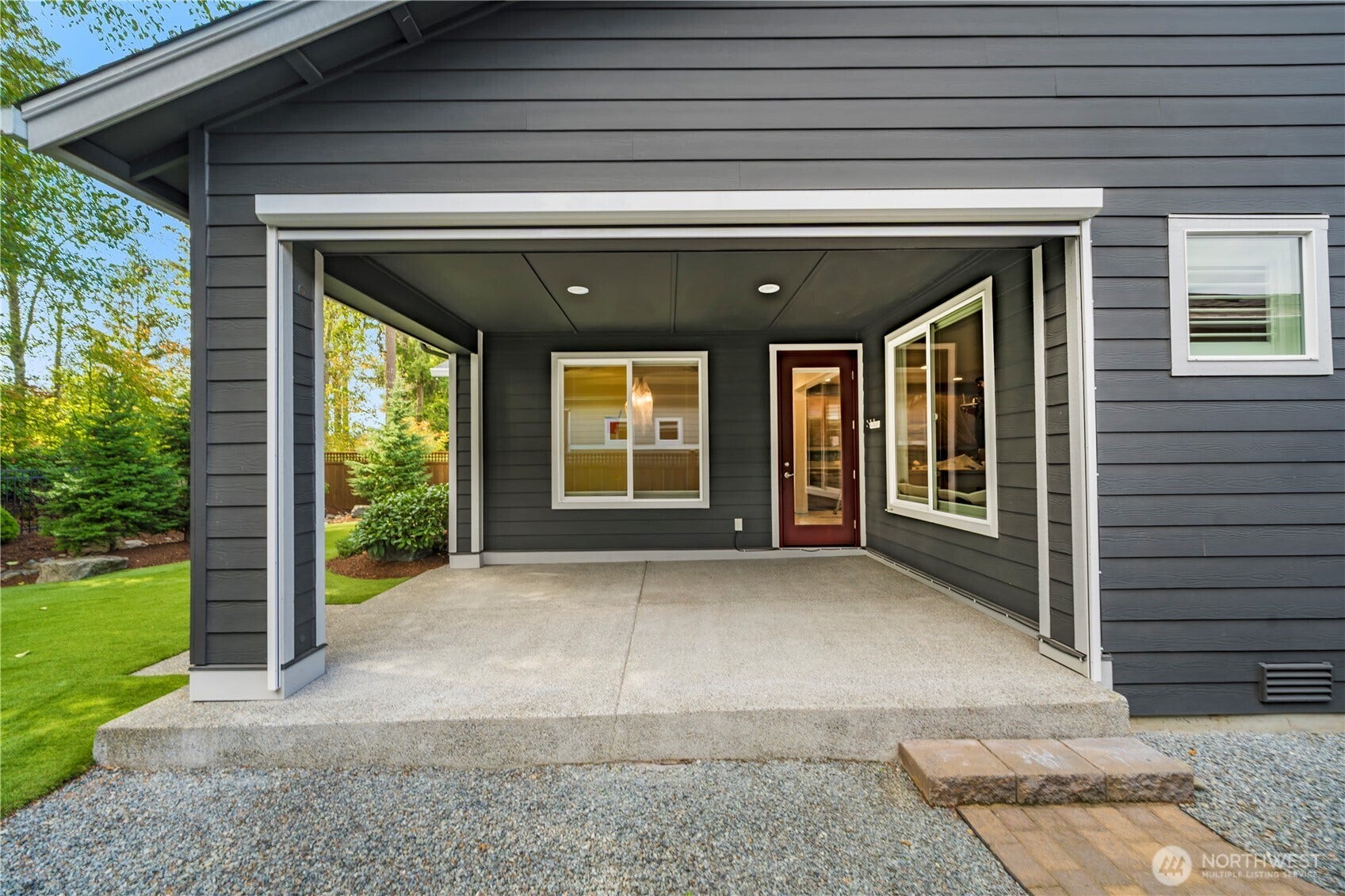 19014 146th Street E, Bonney Lake, WA 98391 The huge covered patio overlooking this beautiful and low maintenance backyard. Motorized sun/privacy screen.