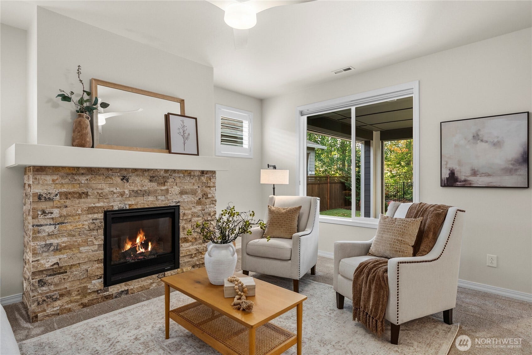 19014 146th Street E, Bonney Lake, WA 98391 The stacked stone fireplace anchors the main living space.