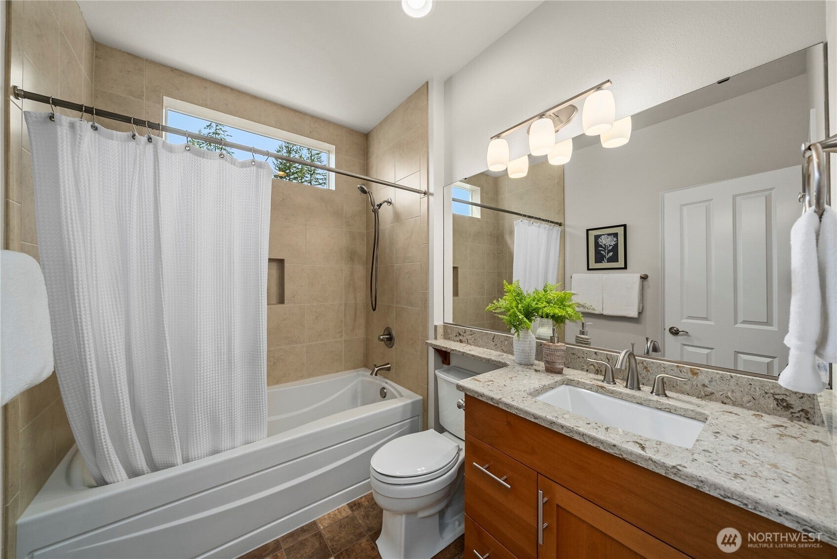 19014 146th Street E, Bonney Lake, WA 98391 Guest bath with an oversized tub with tile surround and Quartz counters.