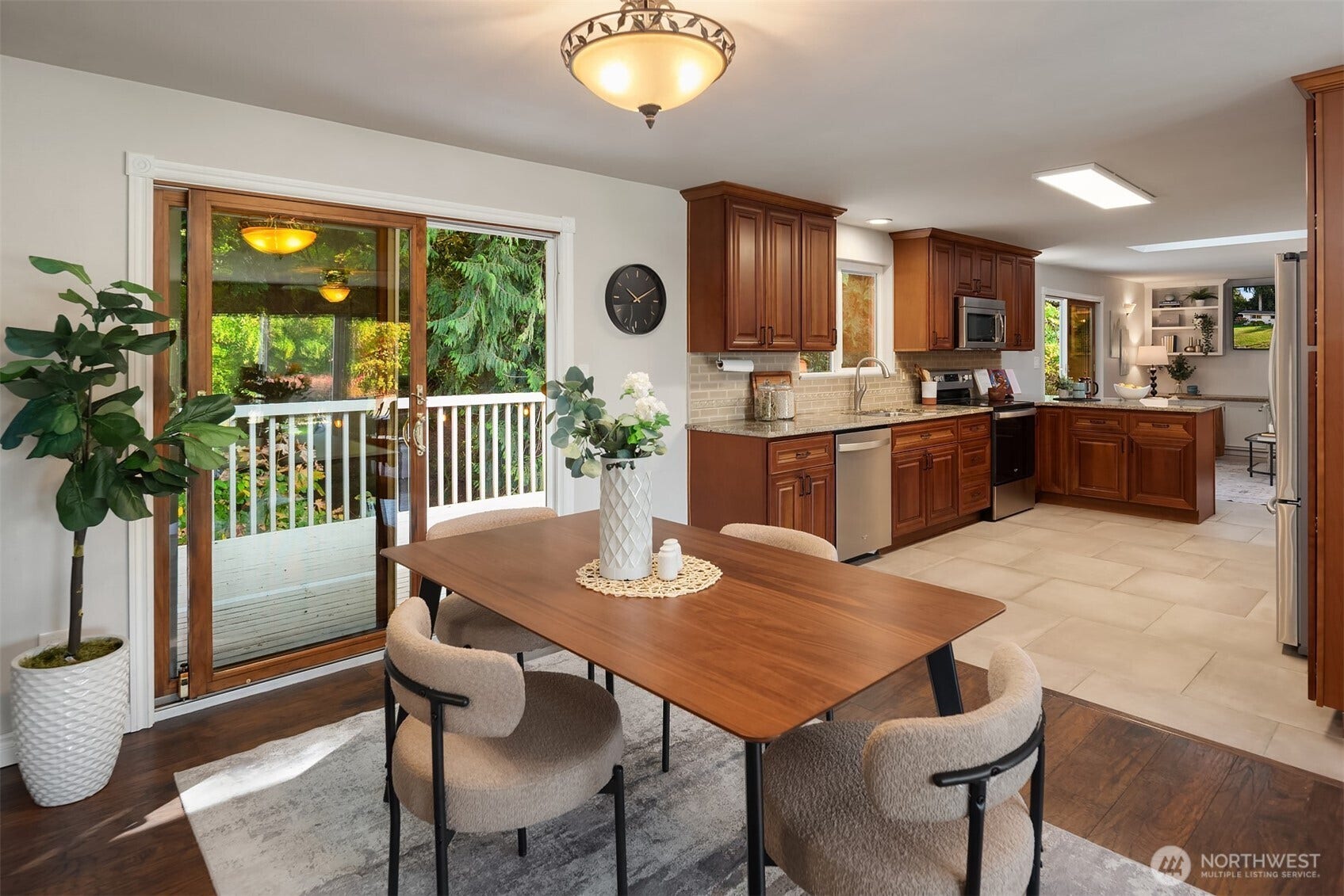 12824 141st Place SE, Snohomish, WA 98290 Entertain effortlessly with easy access to your outdoor deck for dining alfresco under the stars.
