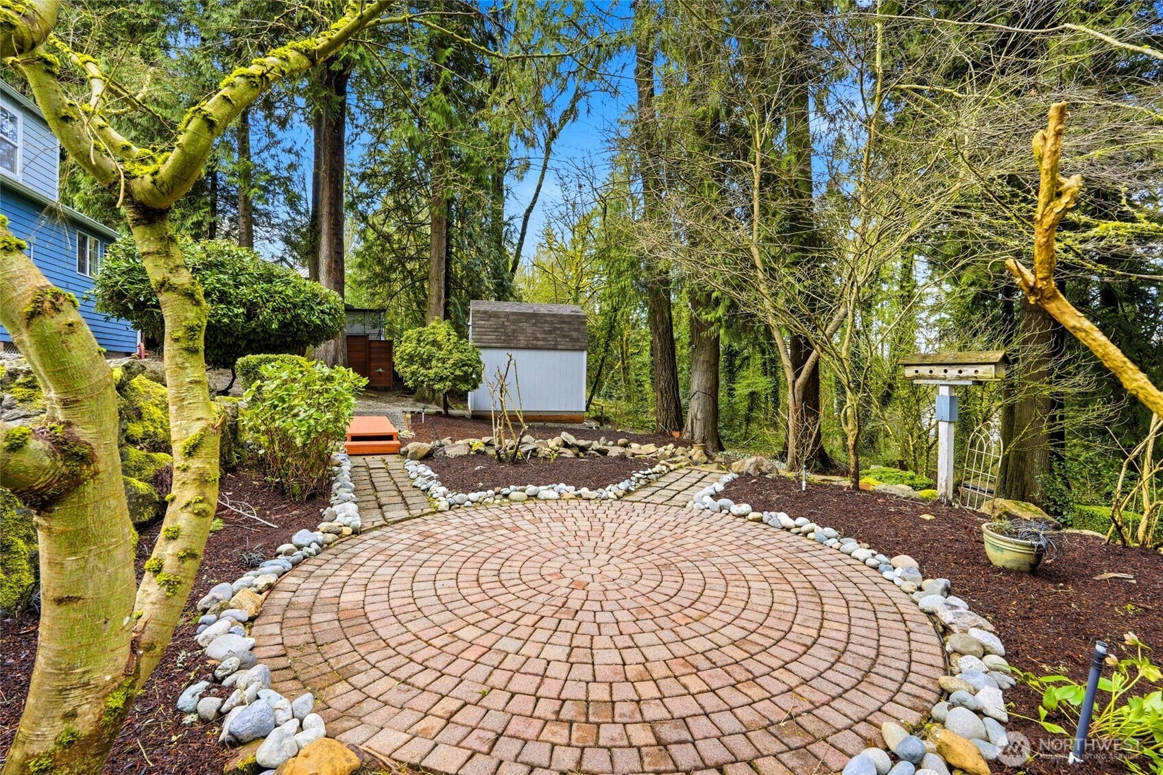 16714 SE Newport Way, Bellevue, WA 98006 Enjoy summer or evenings with your own firepit or a place to sit back and unwind! Matured, loved and well designed backyard!